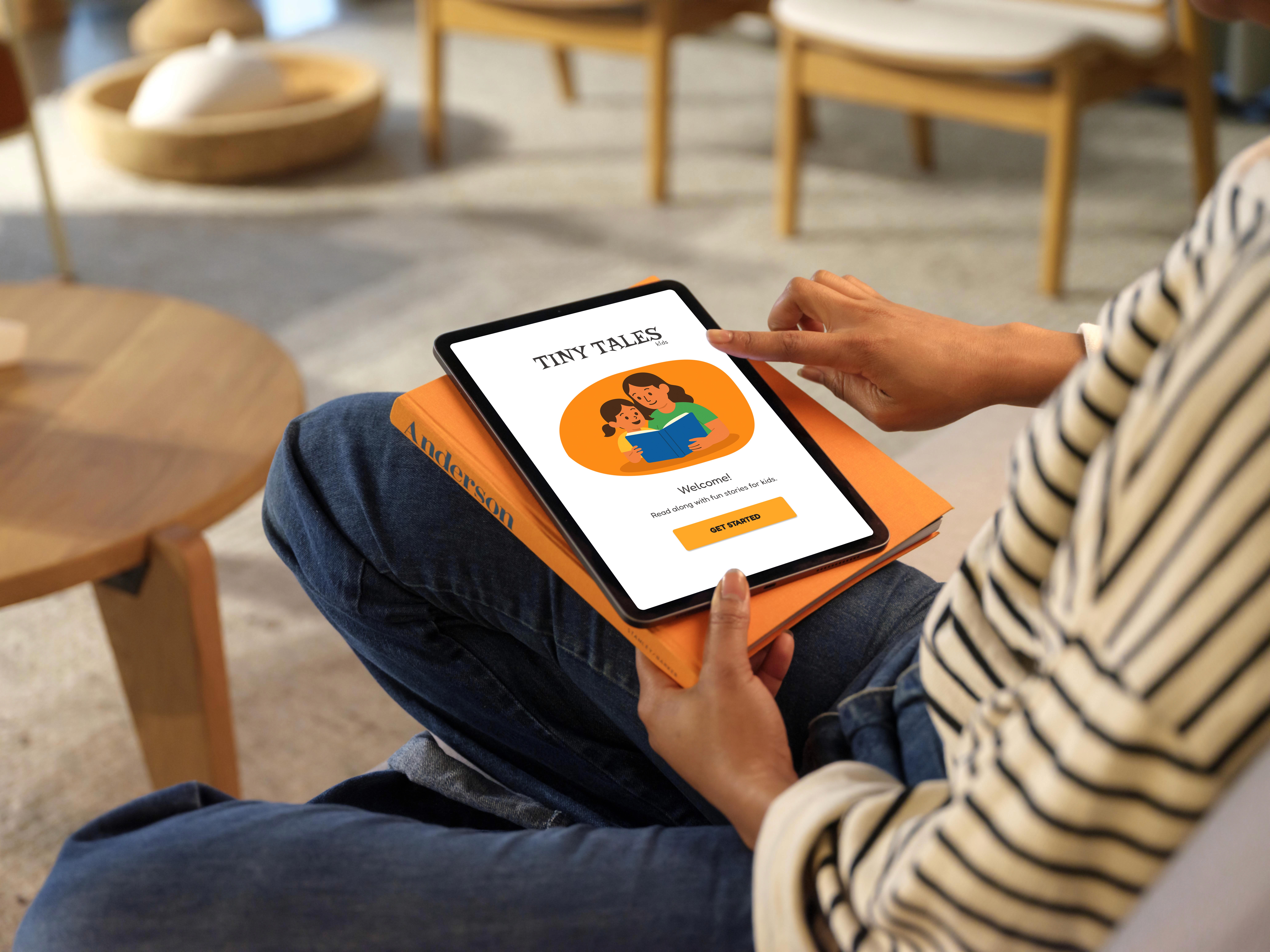 A person opening the tiny tales app in a tablet