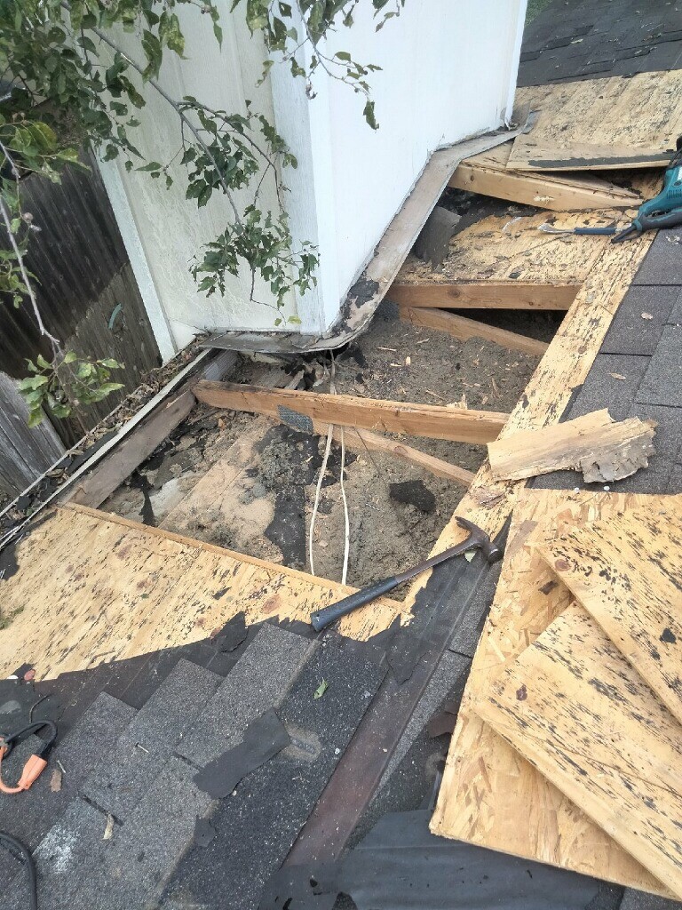 Chimeny repair on a shingle roof. 