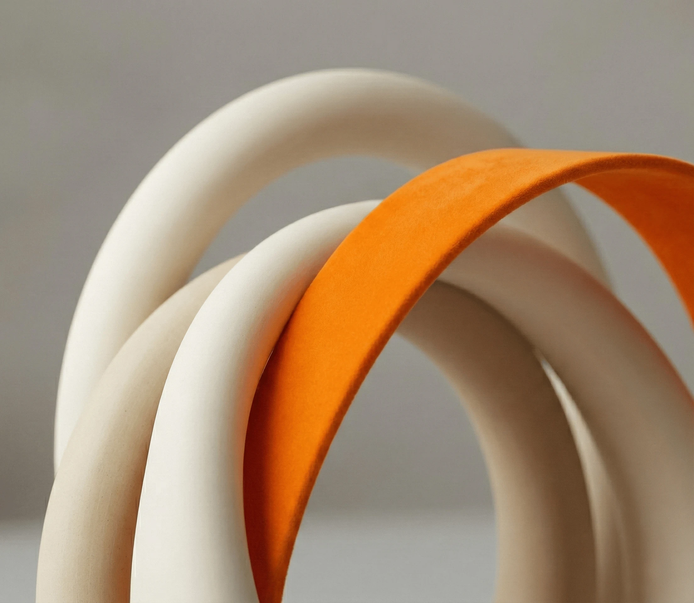 Abstract structure consisting of white wood and an orange band