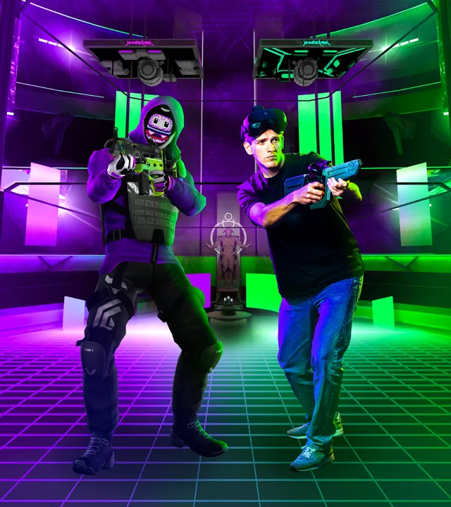 Two players wearing VR headsets and holding gun controllers, posing back-to-back in a purple and green neon-lit arena with futuristic tactical gear avatars.