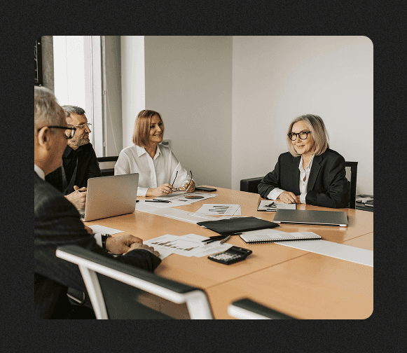A silhouette of a person standing amidst vibrant swirling colors of teal and orange.