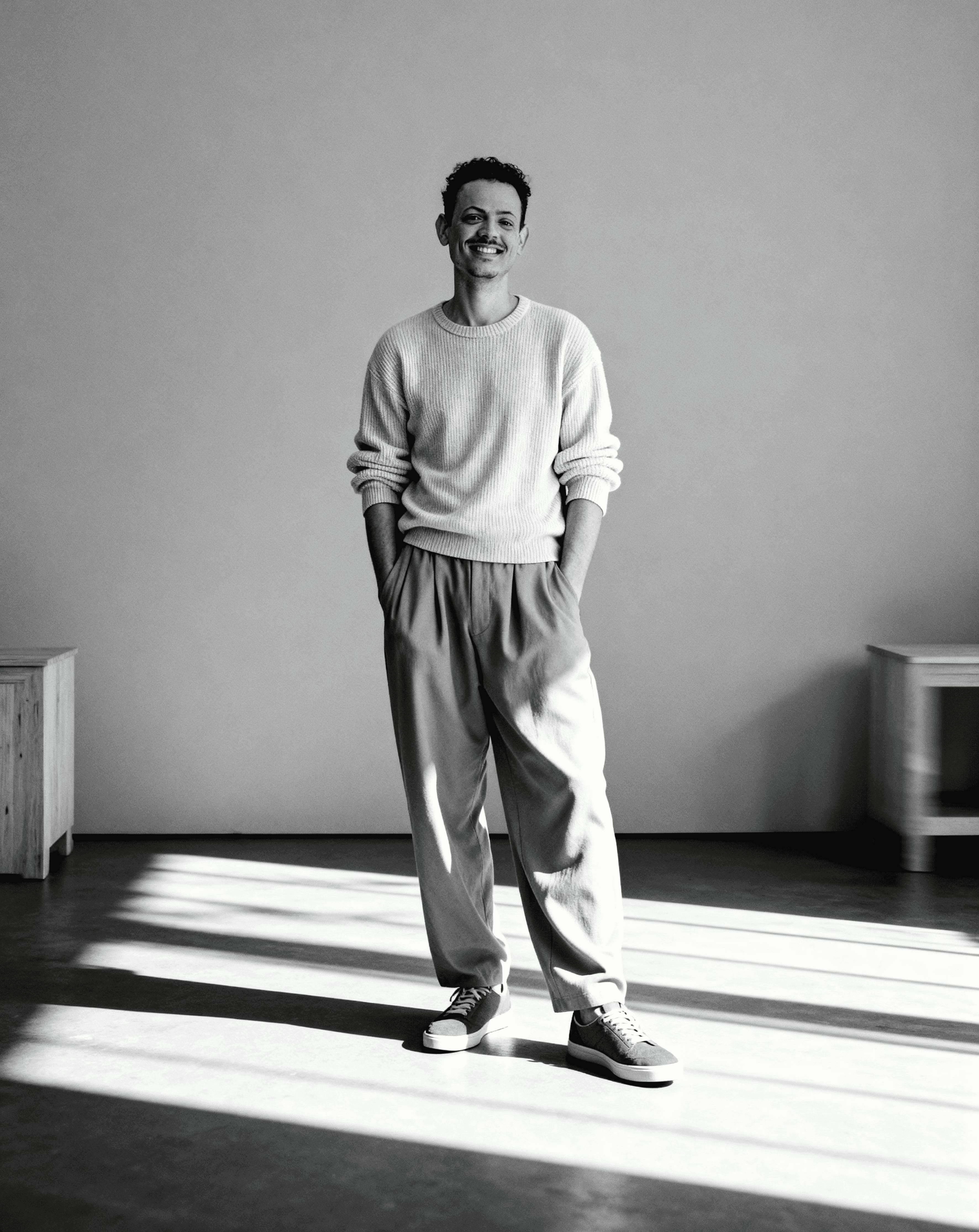 a blurry photo of a person standing in front of a wall