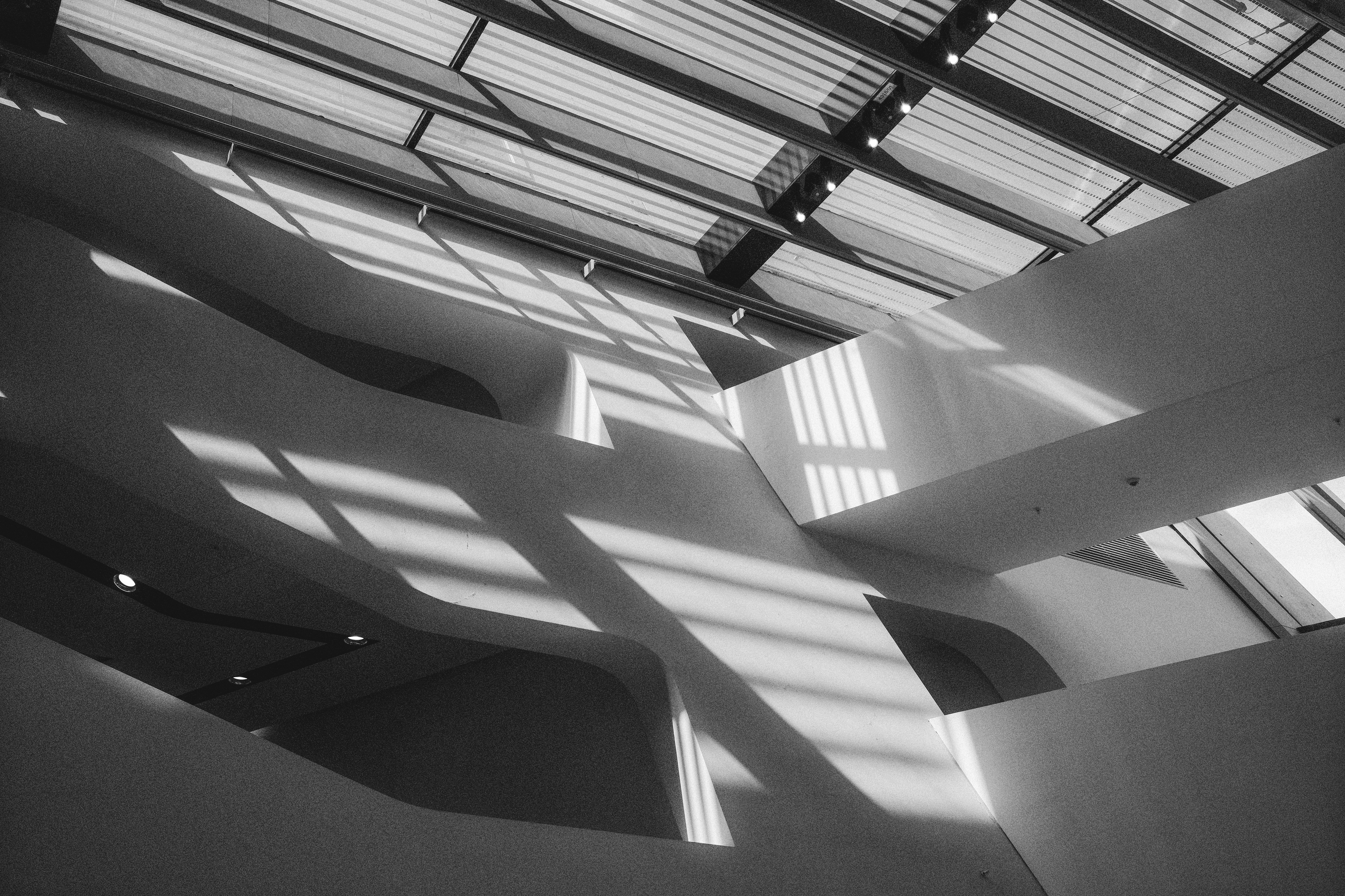 Sunlight and shadows illuminate the abstract architecture.