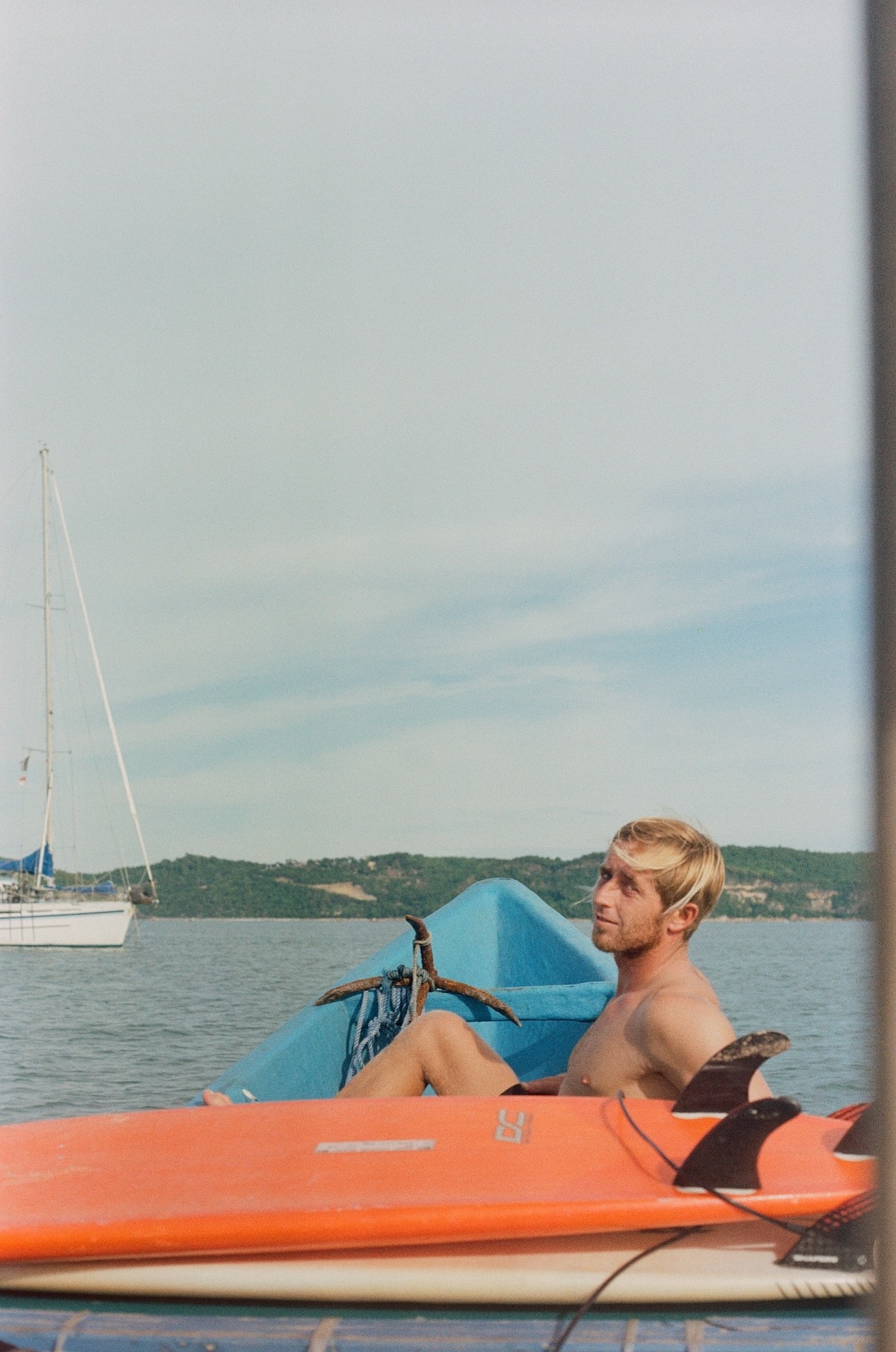 film photography of the surfer on the boat in Lombok 
