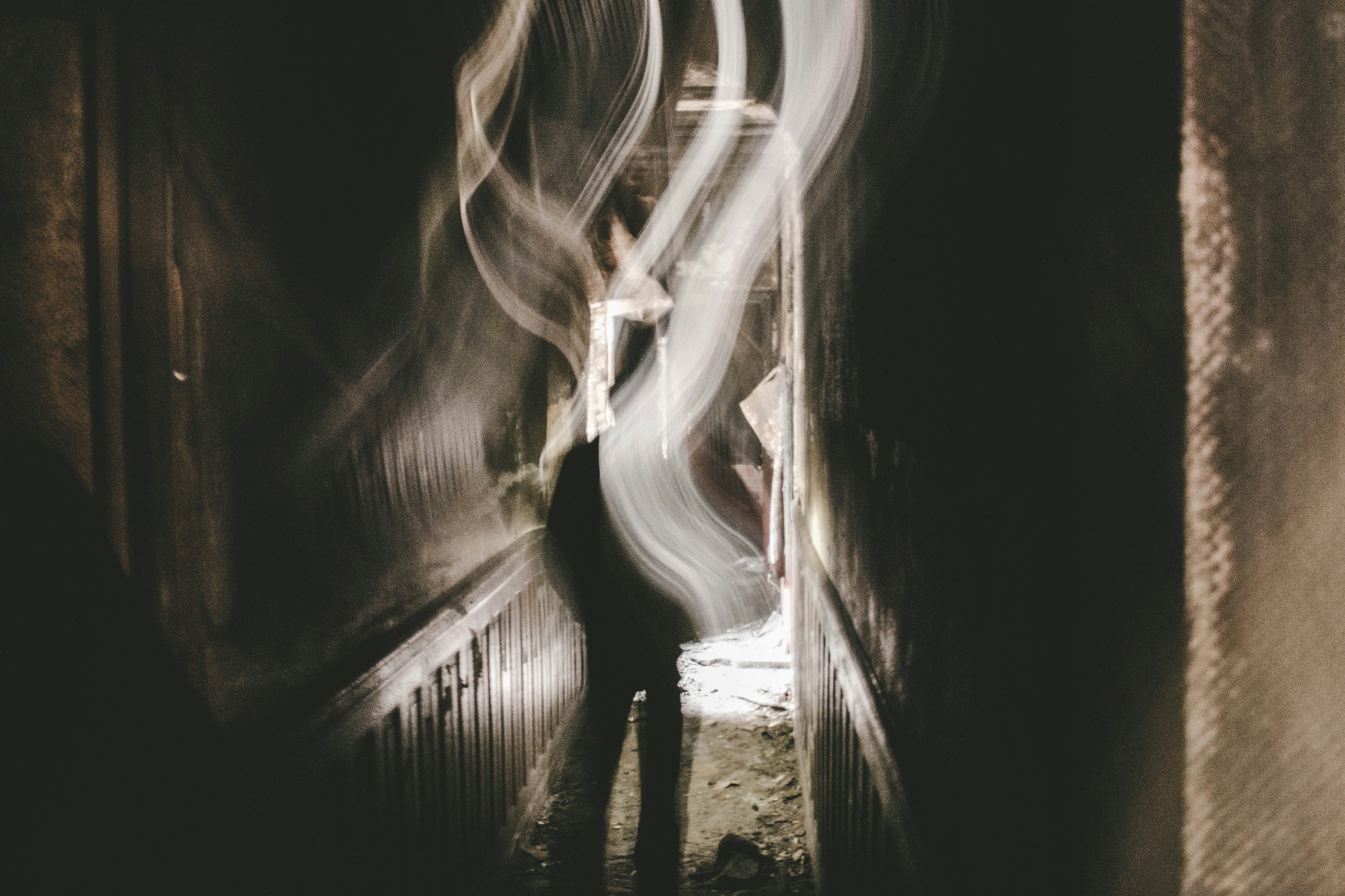 a blurry photo of a person walking down a hallway
