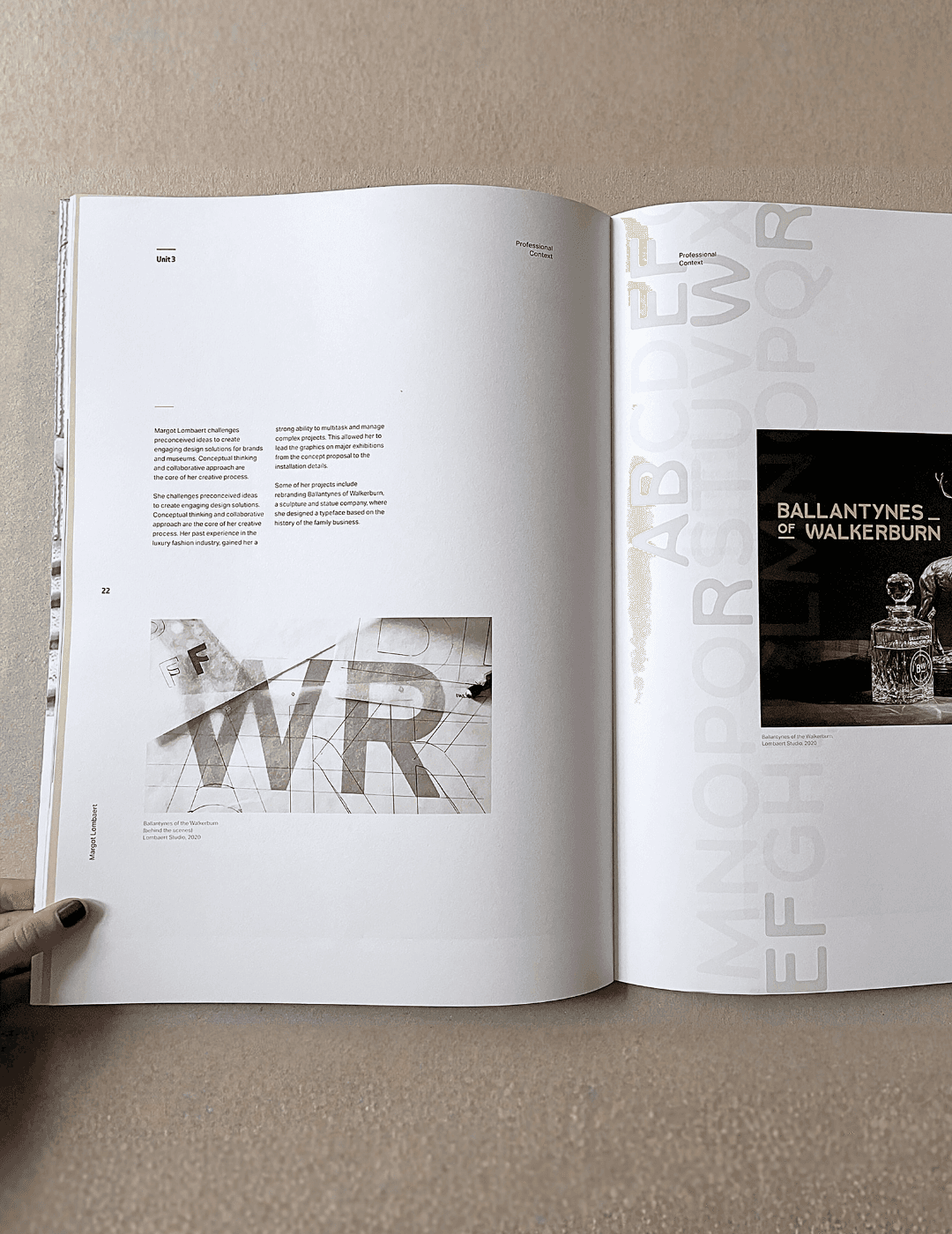 Modern black leather armchair with a chrome frame on a gradient background.