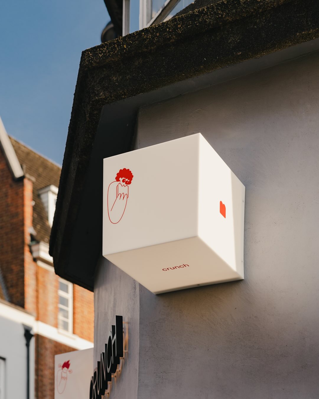 man in blue long sleeve shirt sitting on gray couch