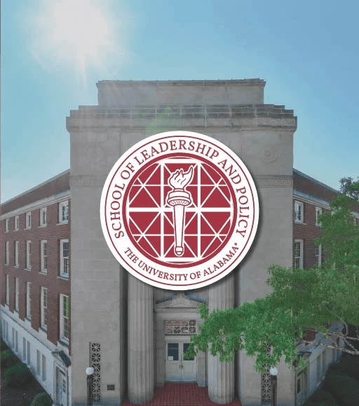 three girls holding hands infront of a football stadium