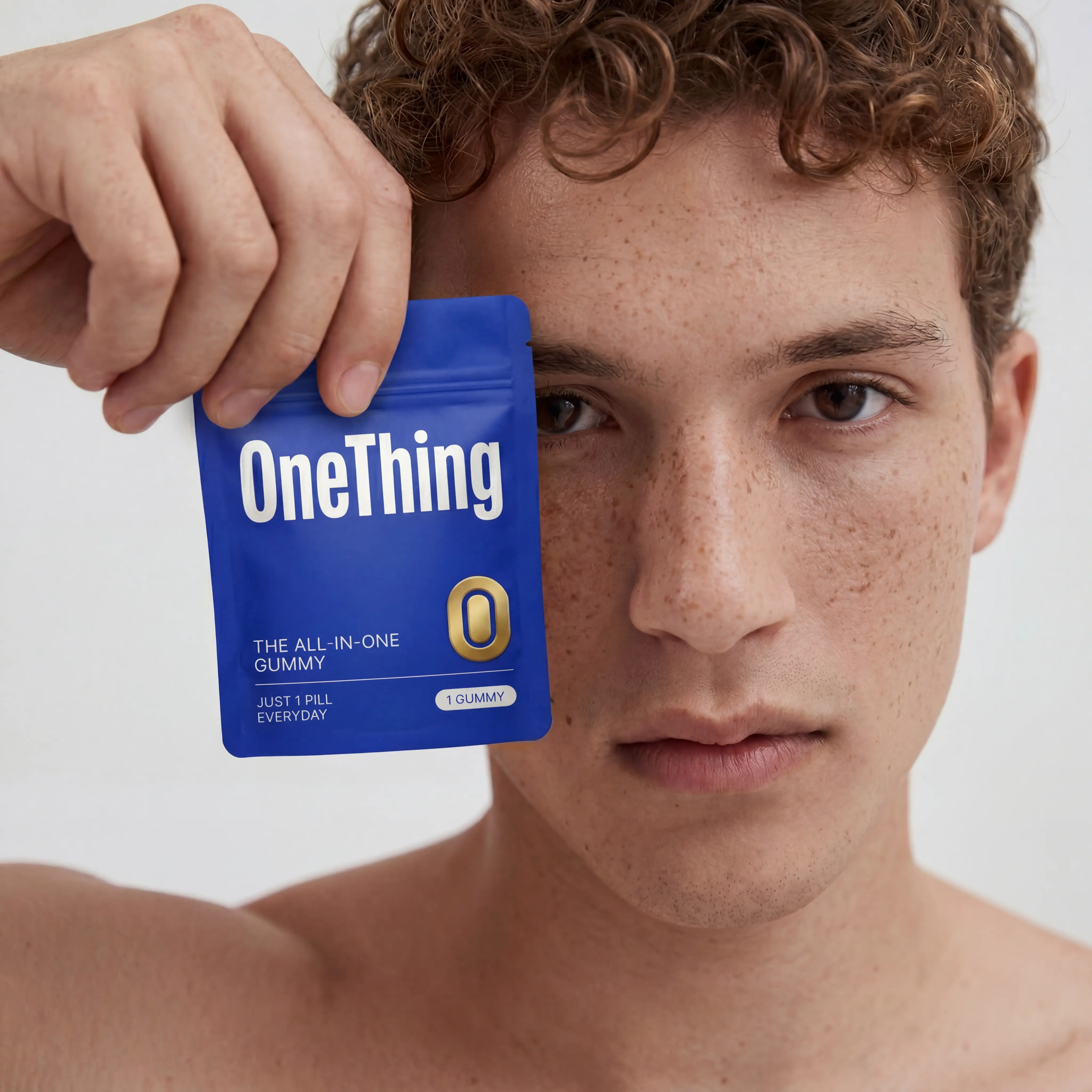 Person holding supplement sachet next to his face