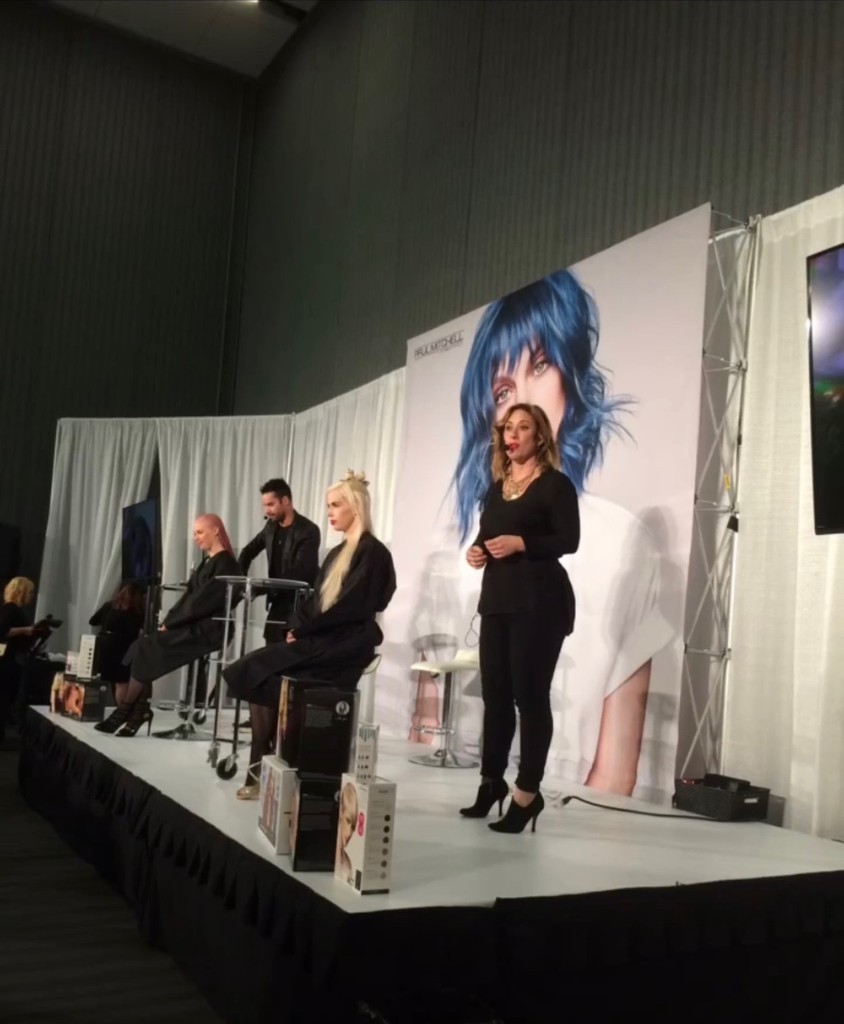 Jenn Montoya Palmore speaking at a Paul Mitchell beauty industry event – sharing expertise in hair color and styling at Bomane Salon, Beverly Hills.