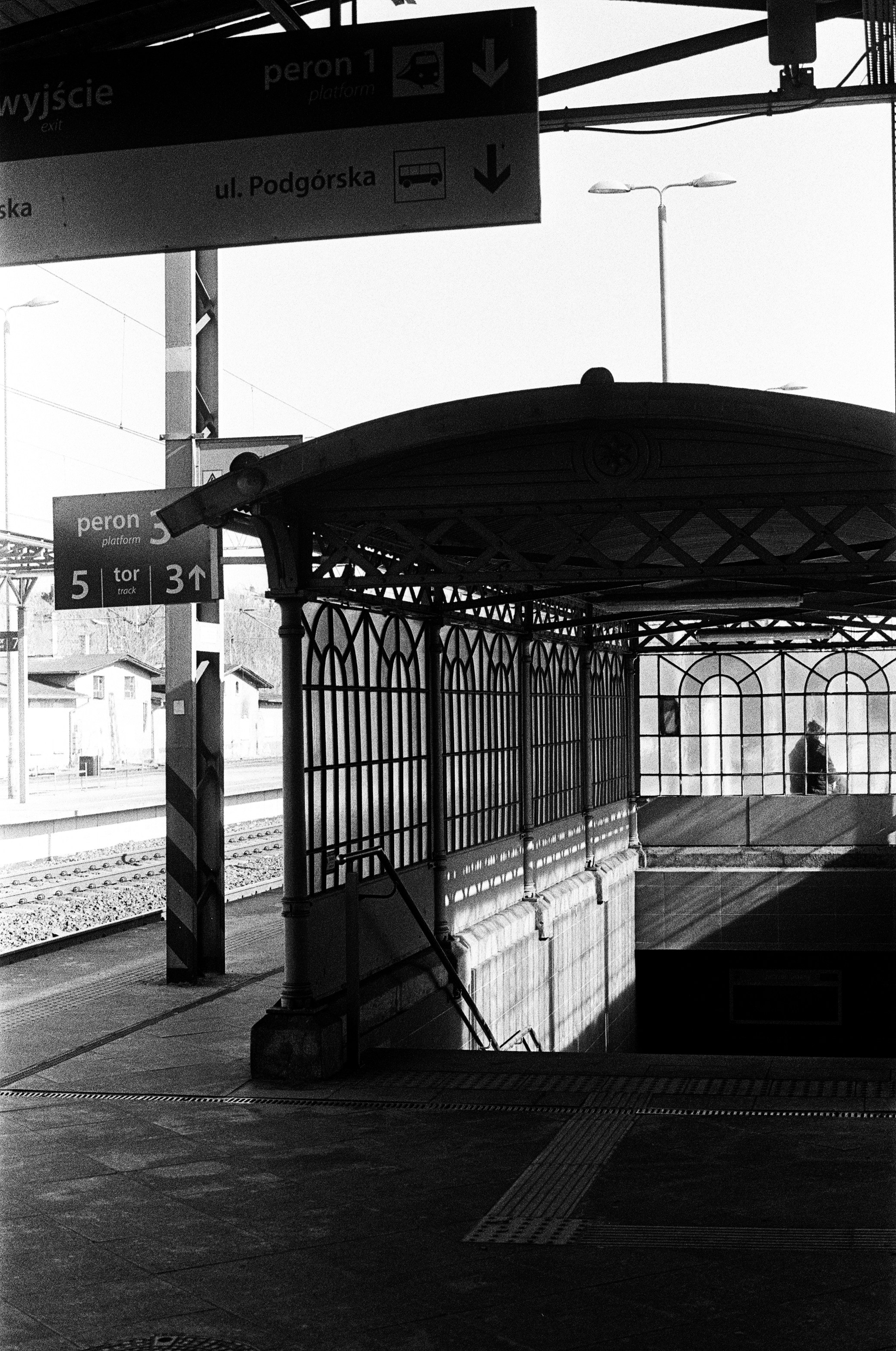 Man walks at a train station entrance