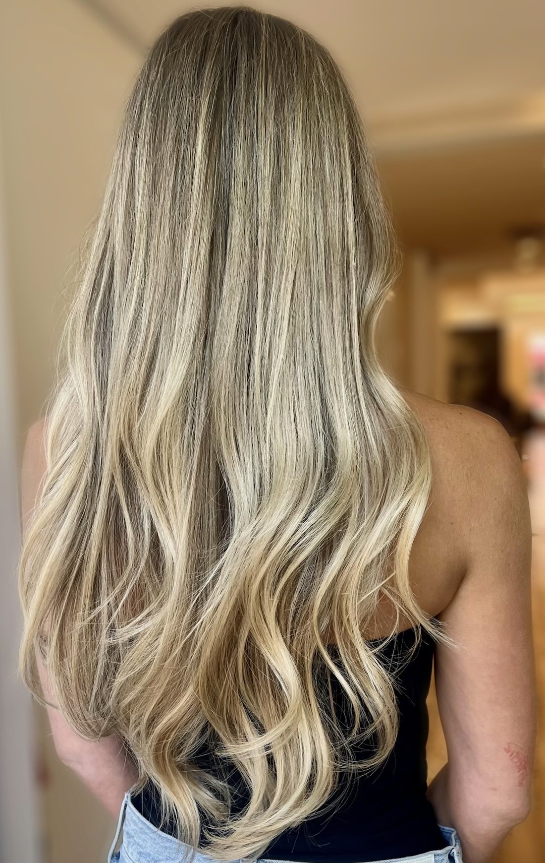 Seamless blonde hair extensions at Bomane Salon, Beverly Hills – natural-looking volume and dimension.