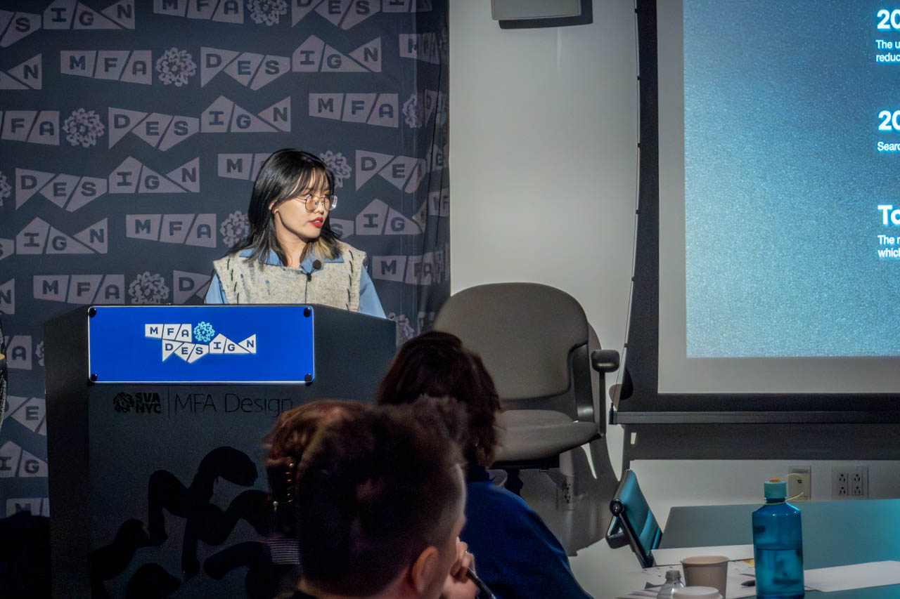 Woman at a podium delivering a presentation