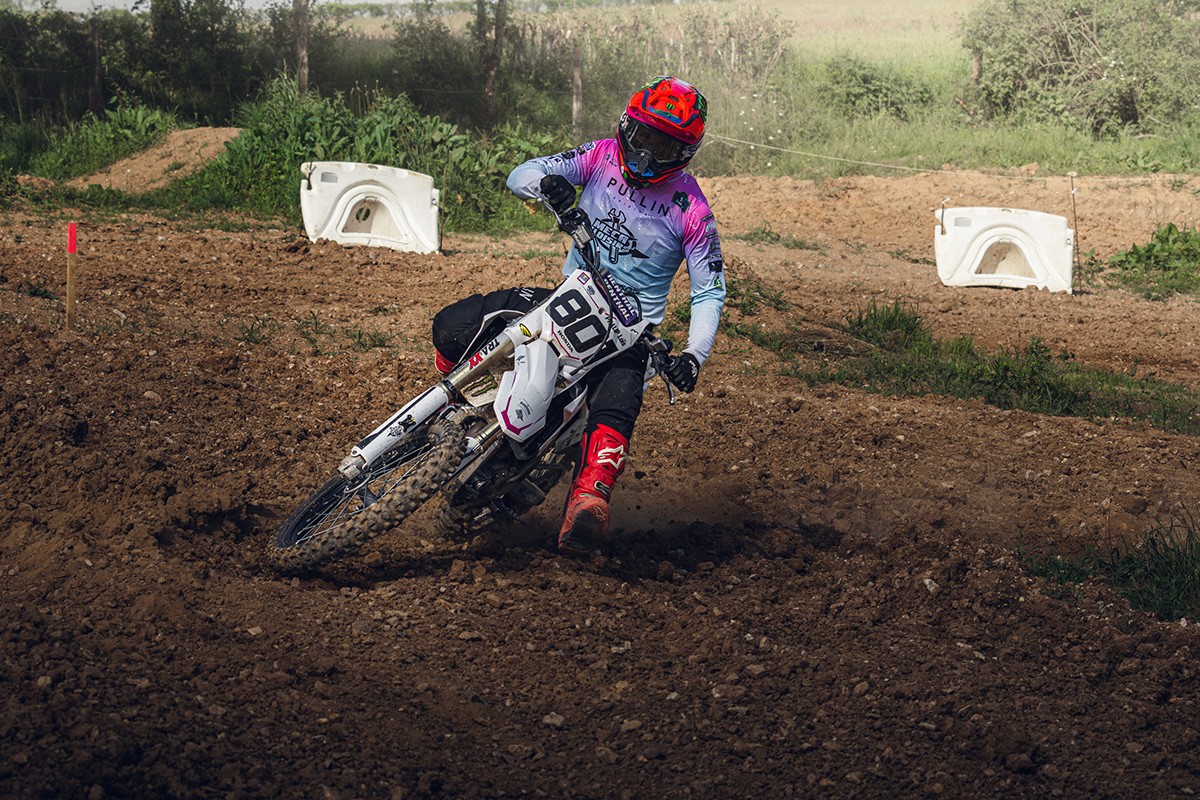 Professional headshot of a person in a formal setting.