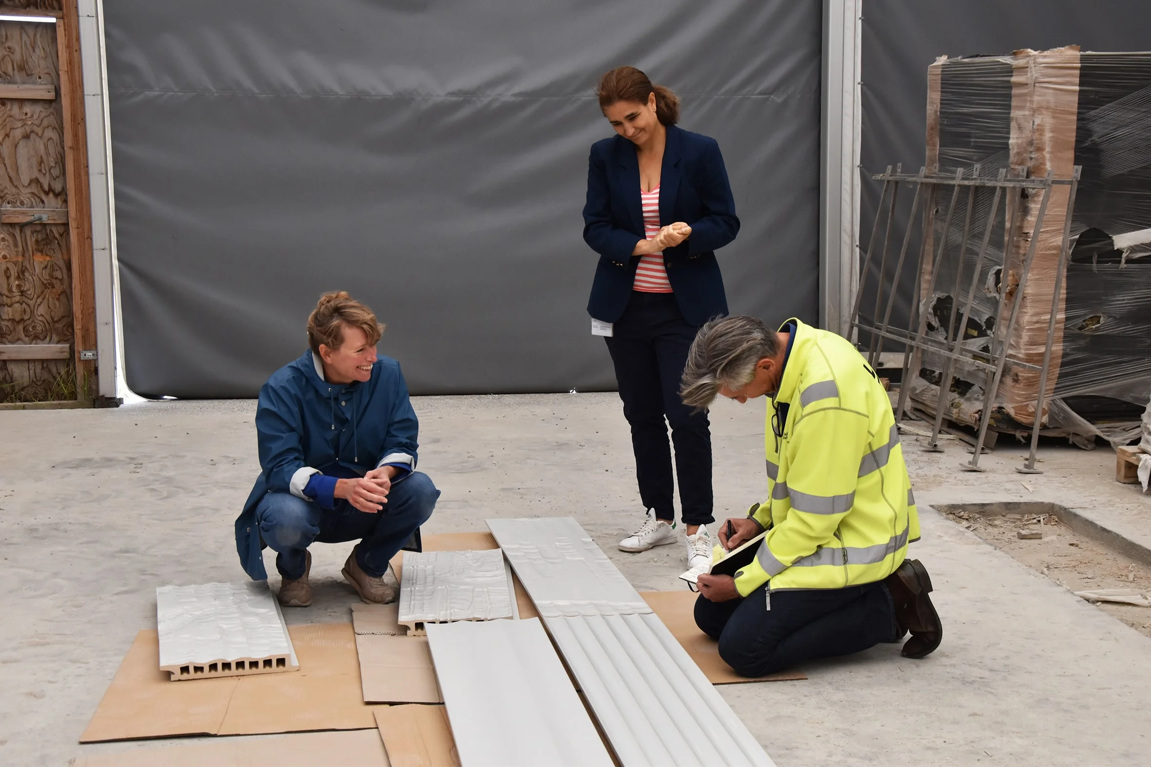 Photograph from the process. Selecting handcut ceramic wall panels with Diana Velaco and Jesper Malmkjær from the Metro Company.
