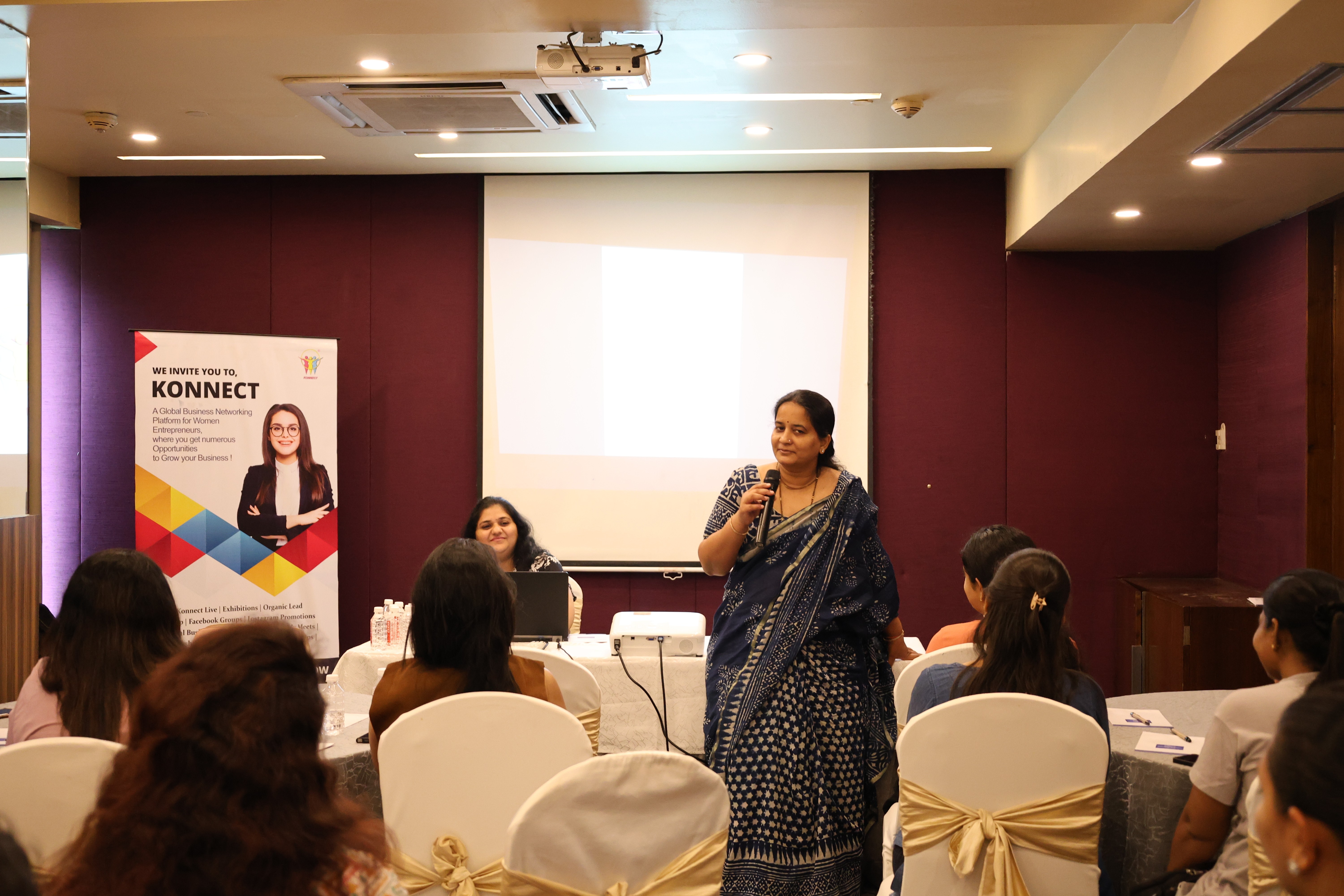 Speaker Presenting at Conference with Audience