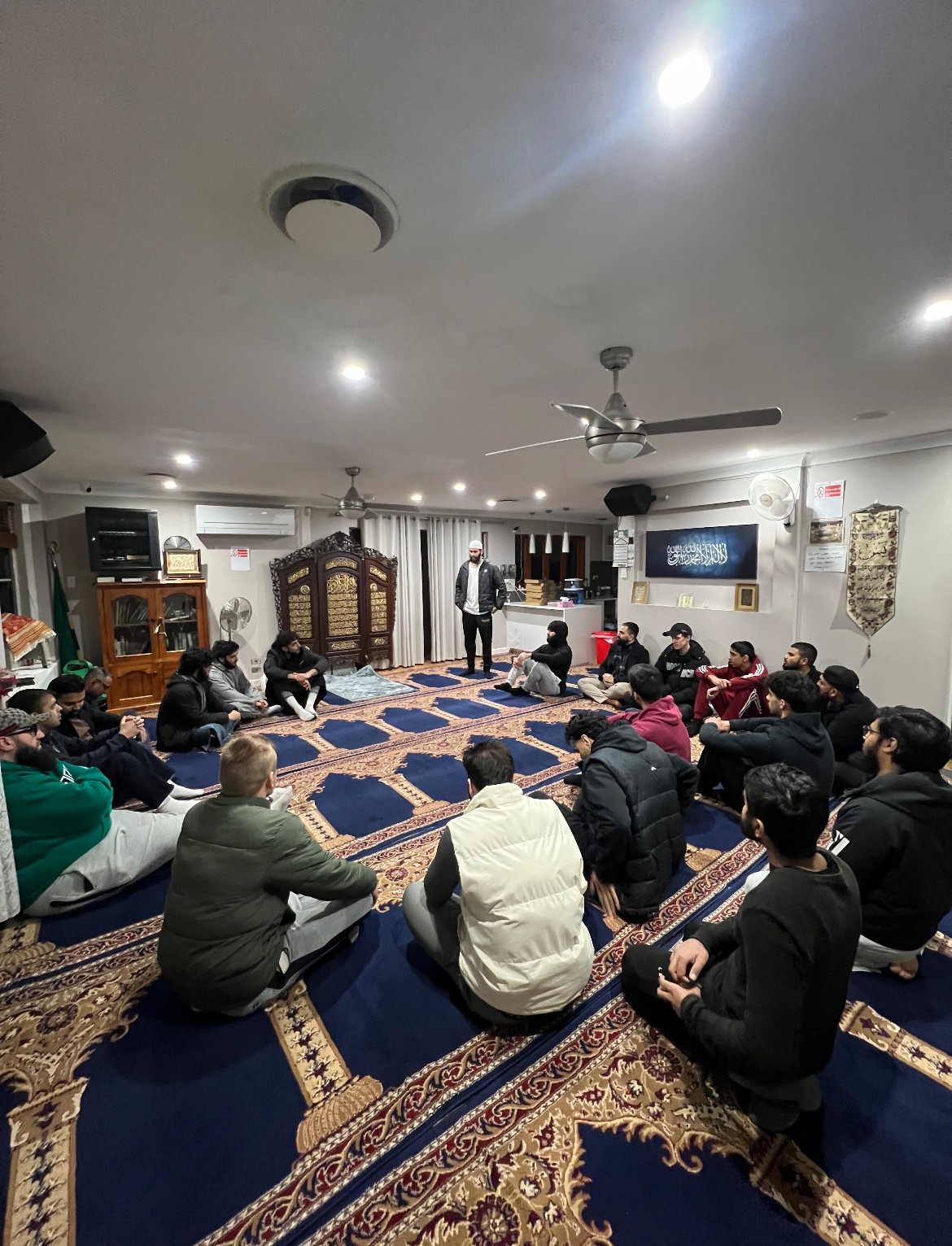 a group of children sitting on steps in front of a building