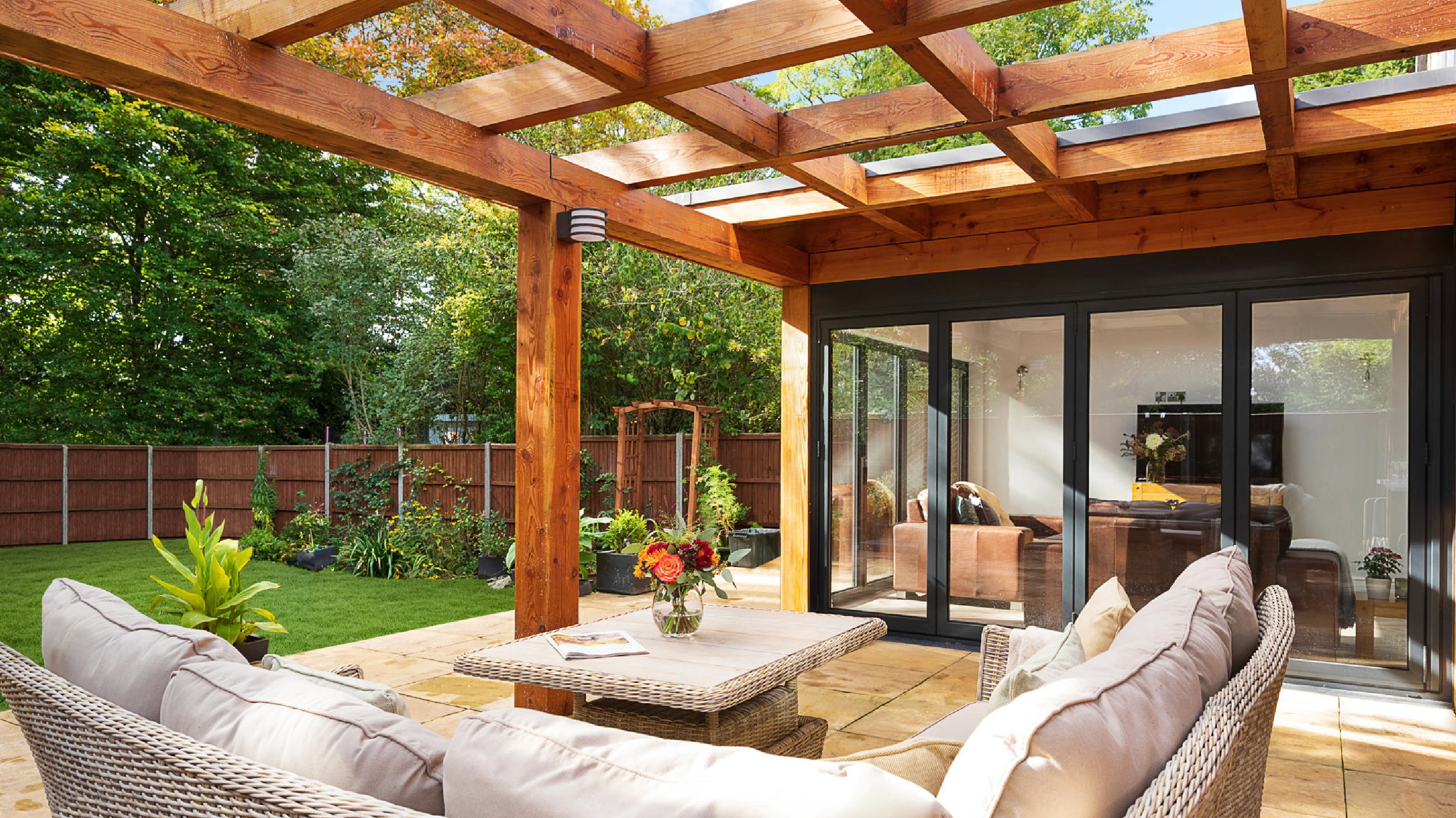 Luckley Road exterior shot of oak pergola and patio seating area