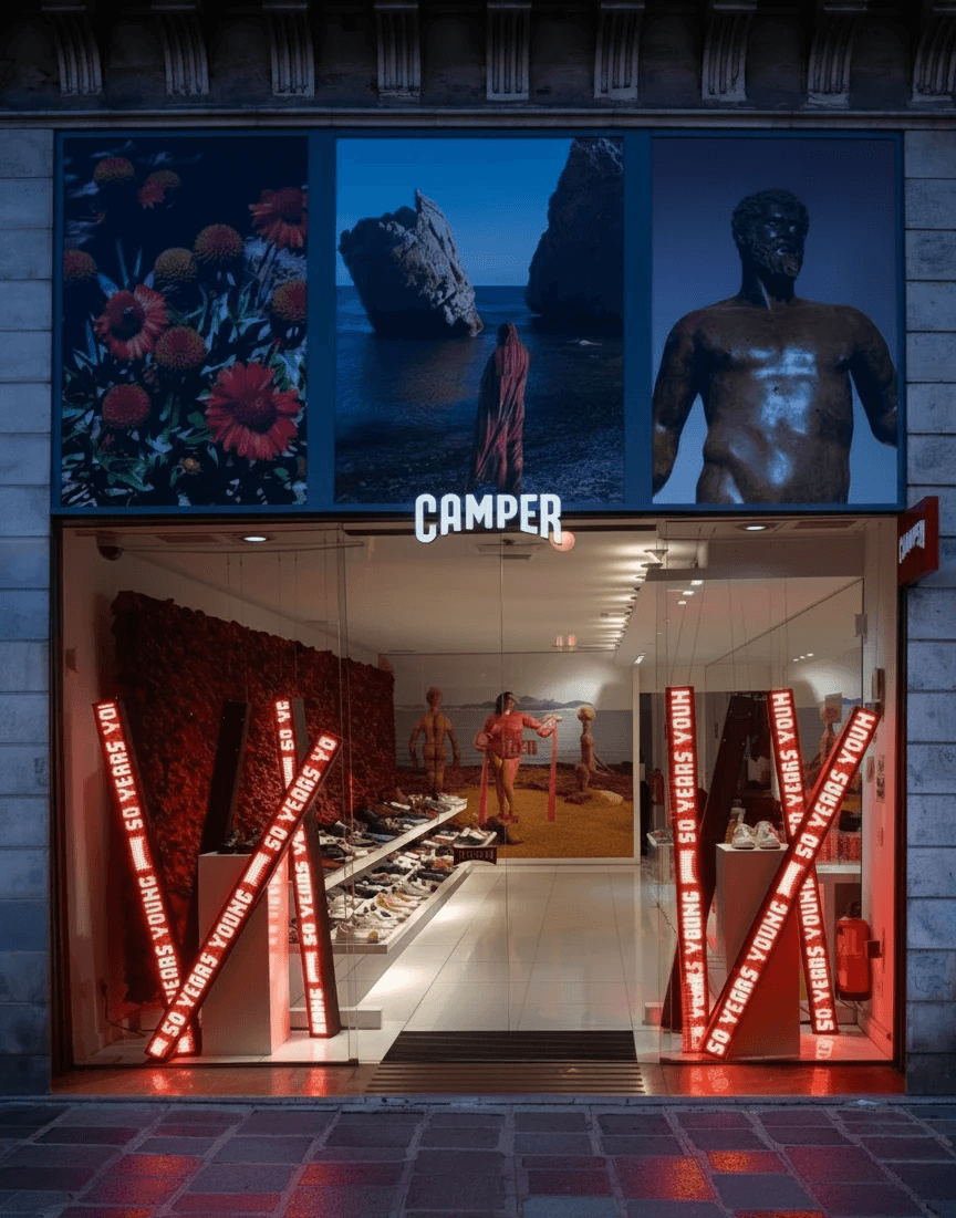 Camper store in Paris (Opéra) with LED bars displaying the 50 years young claim of Camper 50y campaign.