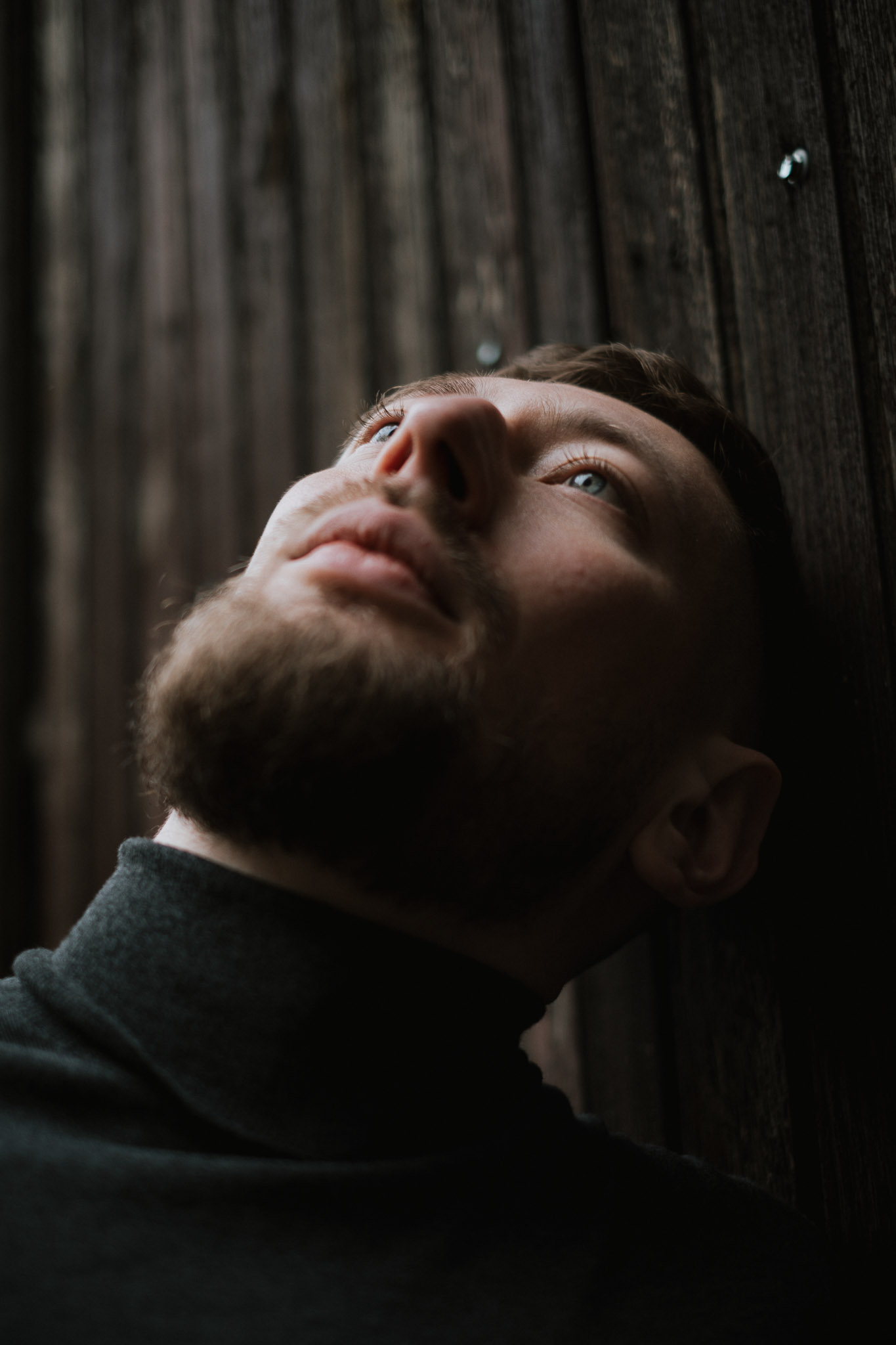 A person stands in a sandstone cave.