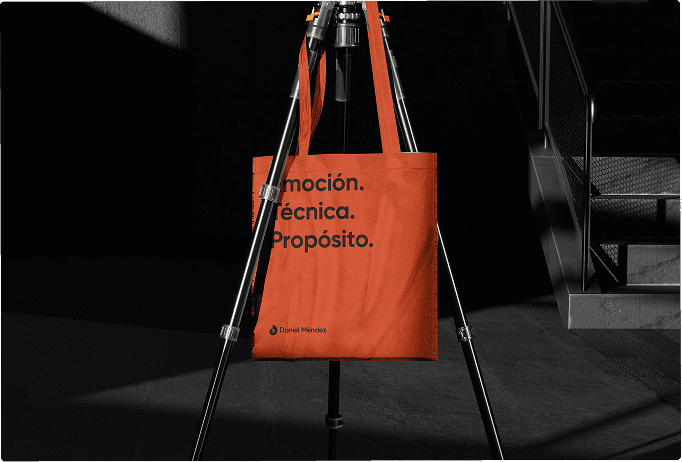 Interior view from living area toward the lake, large glass facade, minimal furniture.