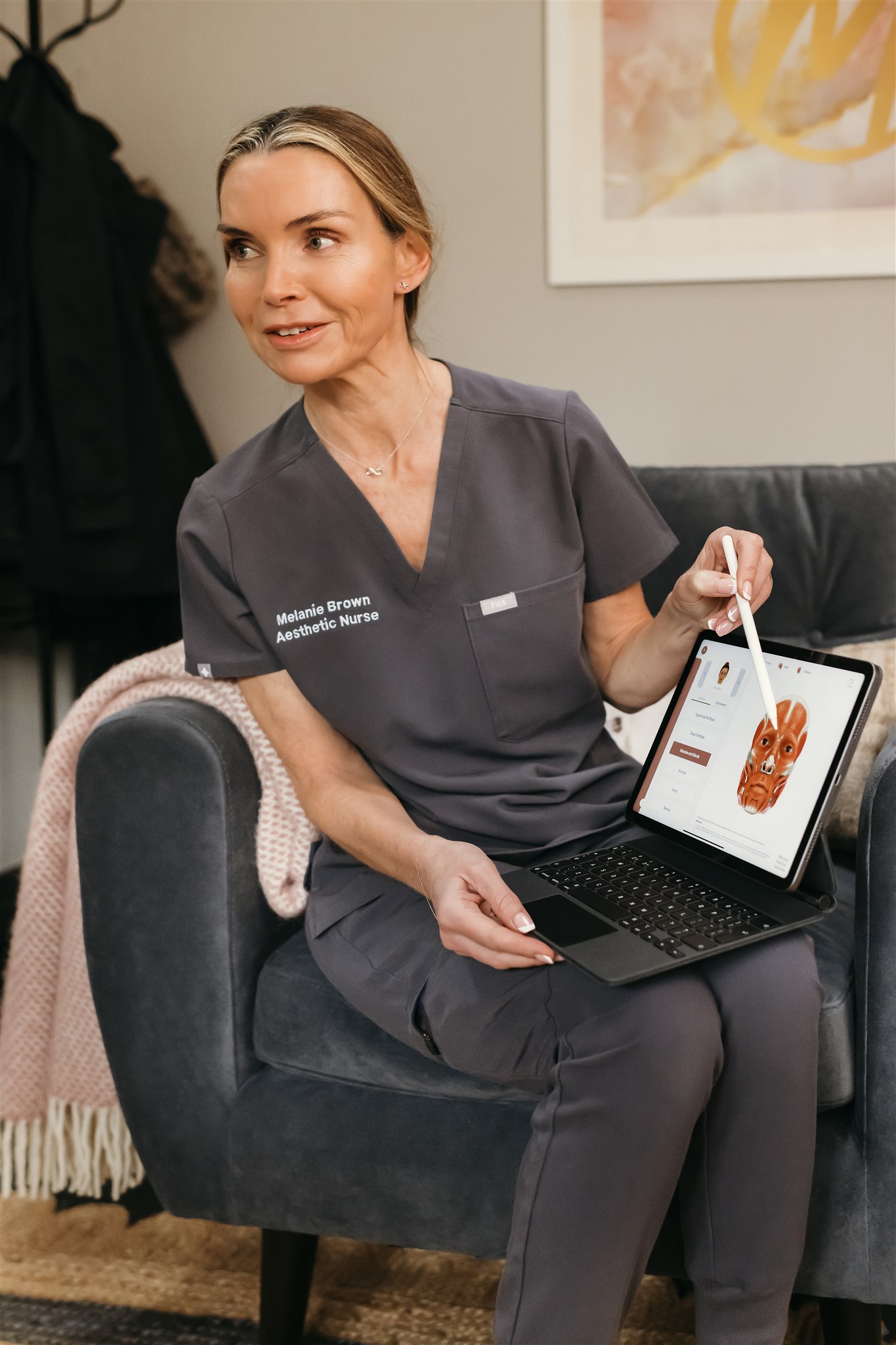 melanie brown talking with a client over a skin consultation