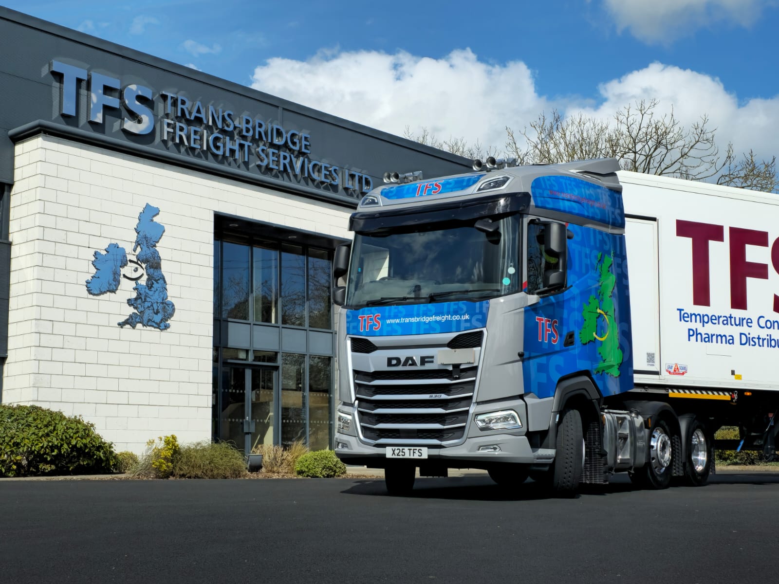 A Trans-bridge freight services lorry drives past the Harland & Wolff cranes