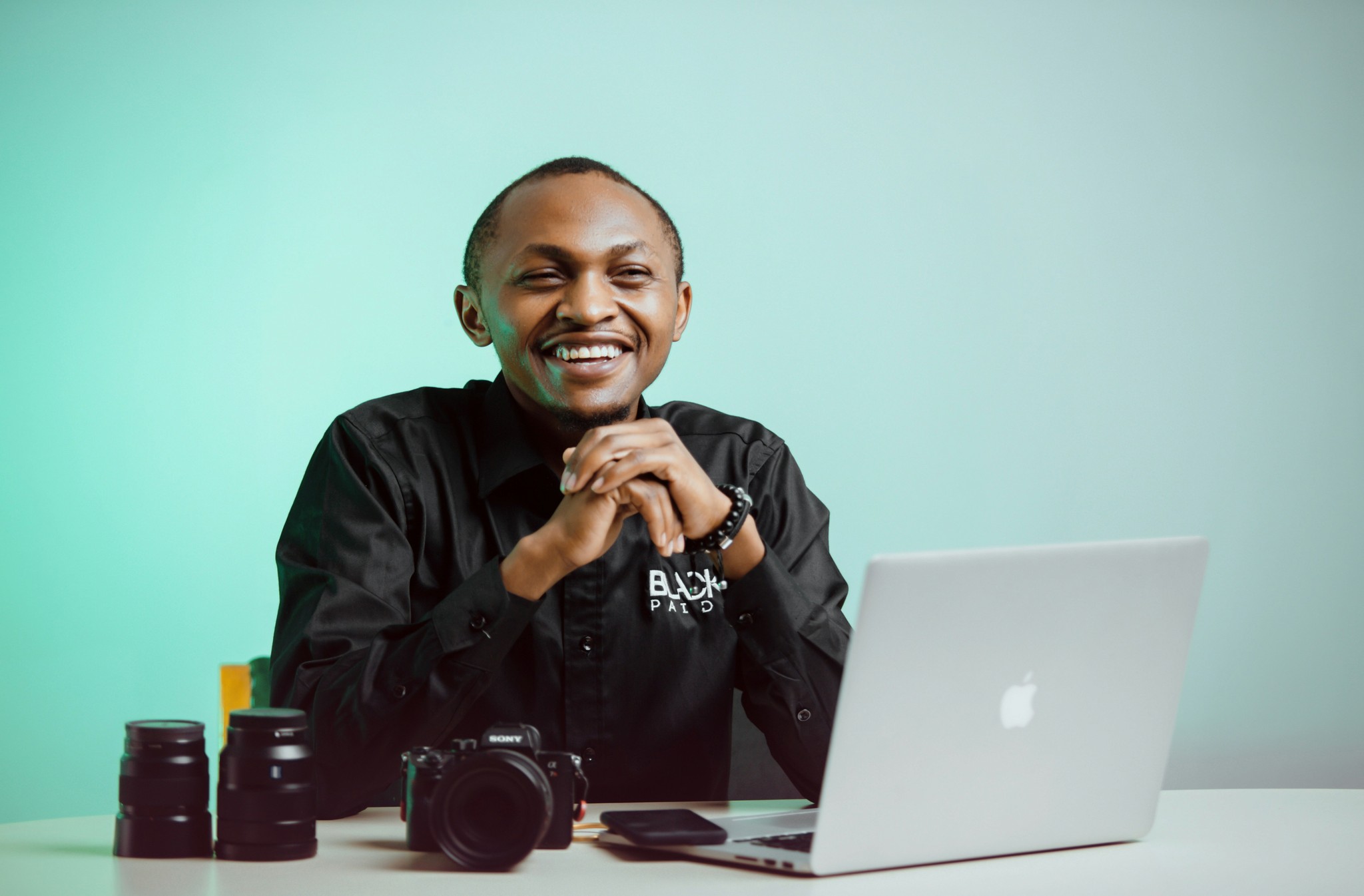 a man sitting in front of a laptop computer