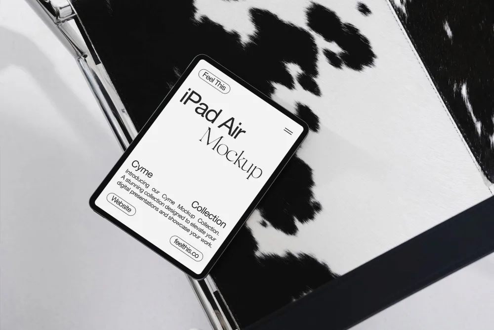 iPad Air mockup featuring a sleek black screen displaying minimal text, placed on a modern cowhide-patterned chair with chrome details. Stylish composition with high-contrast textures and lighting.