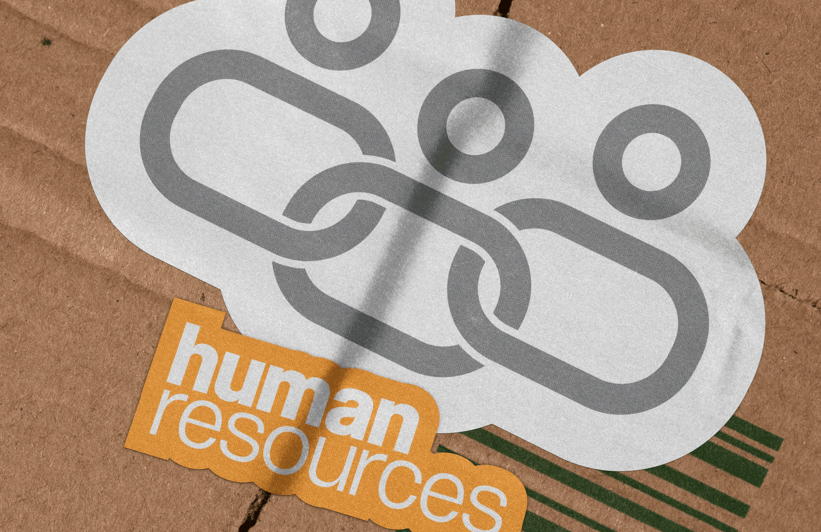 A close-up of a hand wearing multiple decorative rings against a blue background.