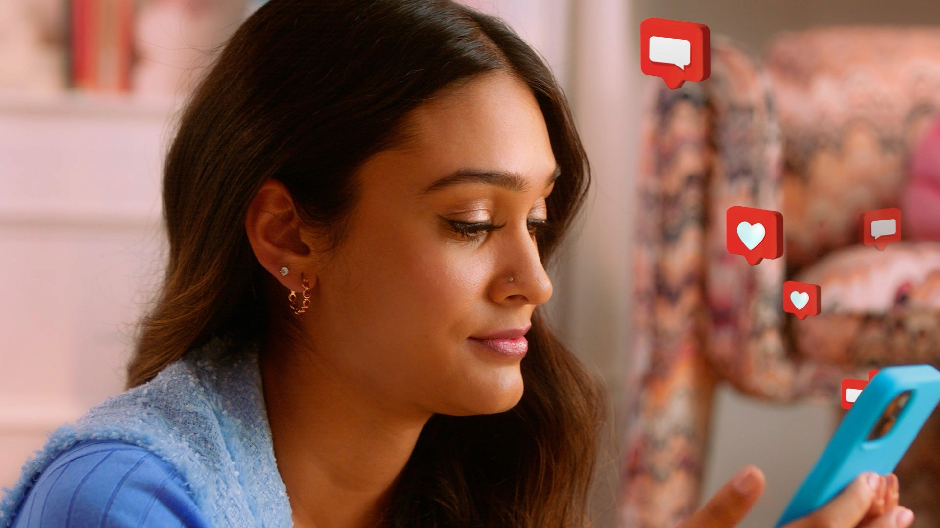 Medium close-up of influencer texting. Live action with graphic overlays.