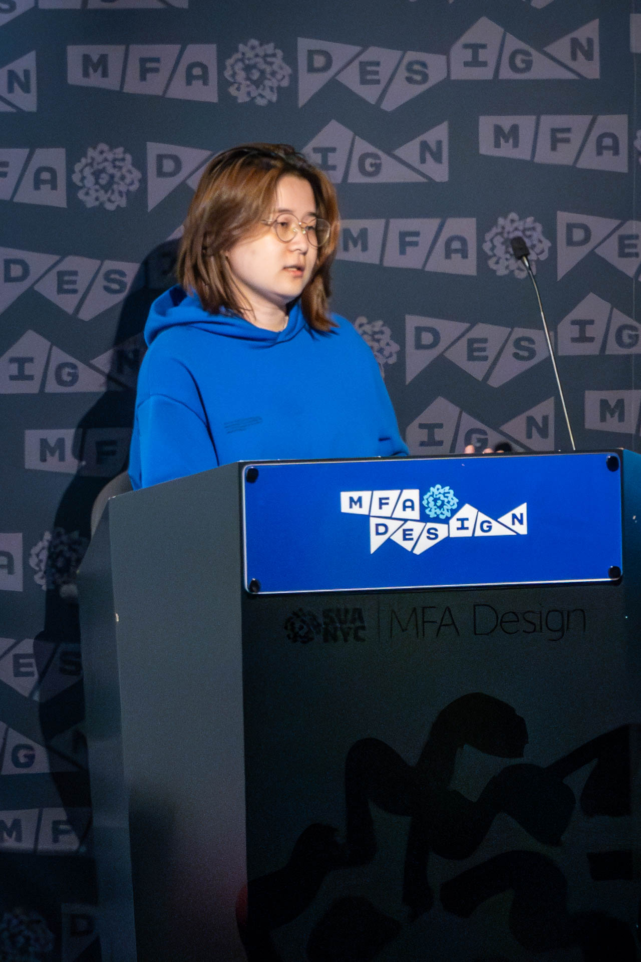 student at a podium giving a presentation