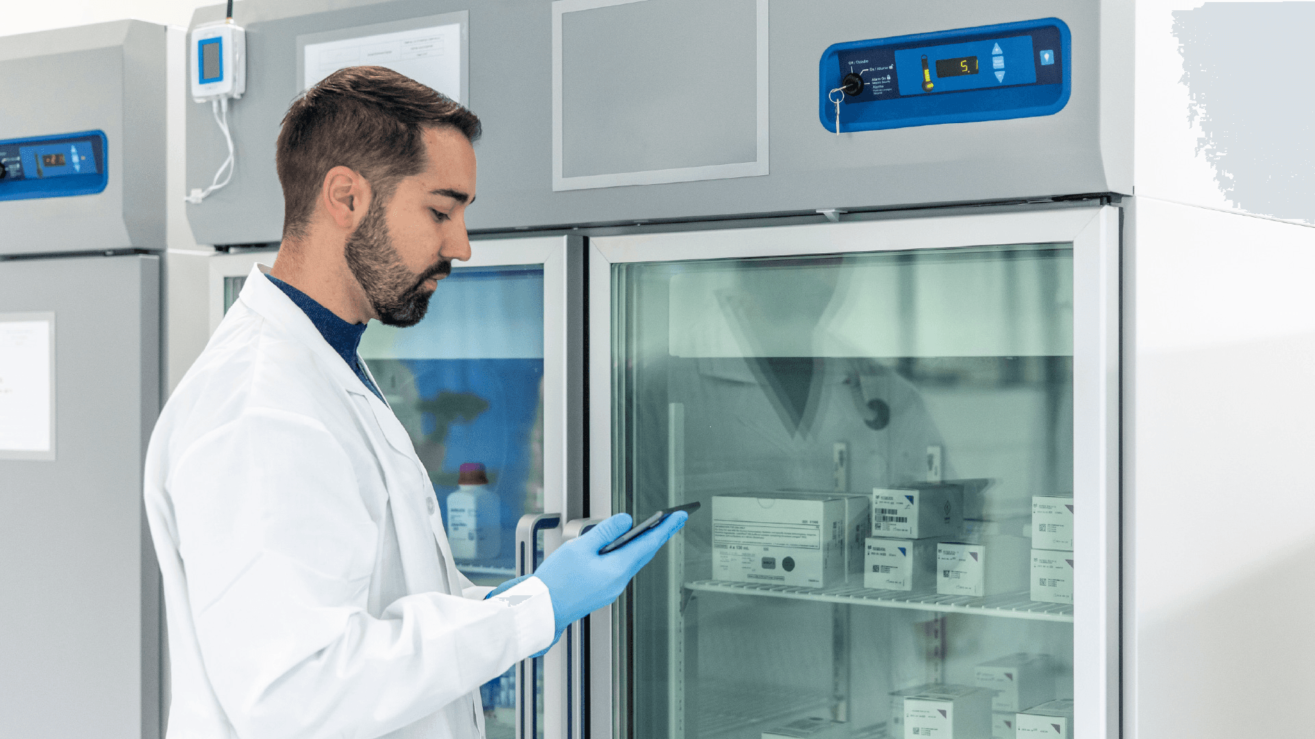 Researcher checking medical storage refrigerator - 503a vs 503b