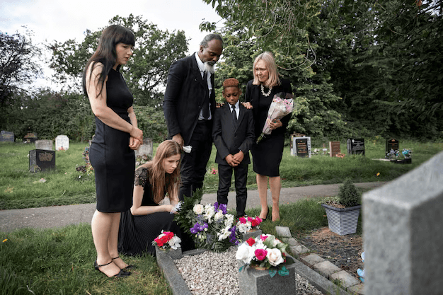 family at gravestone