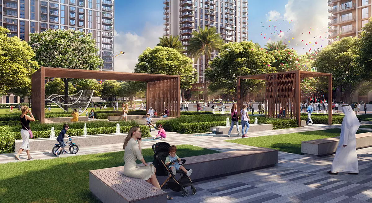 Vibrant community park at Aeon Dubai with families enjoying green spaces, water features, and modern architecture in the background.