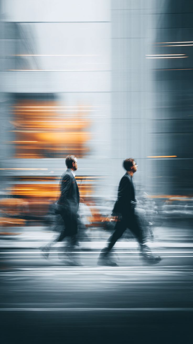 urban motion blur business people crossing street fast pace