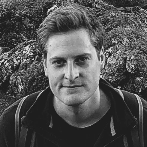Black and white profile picture of Rich Munro who is the Co-Founder & Co-CEO at KanataQ