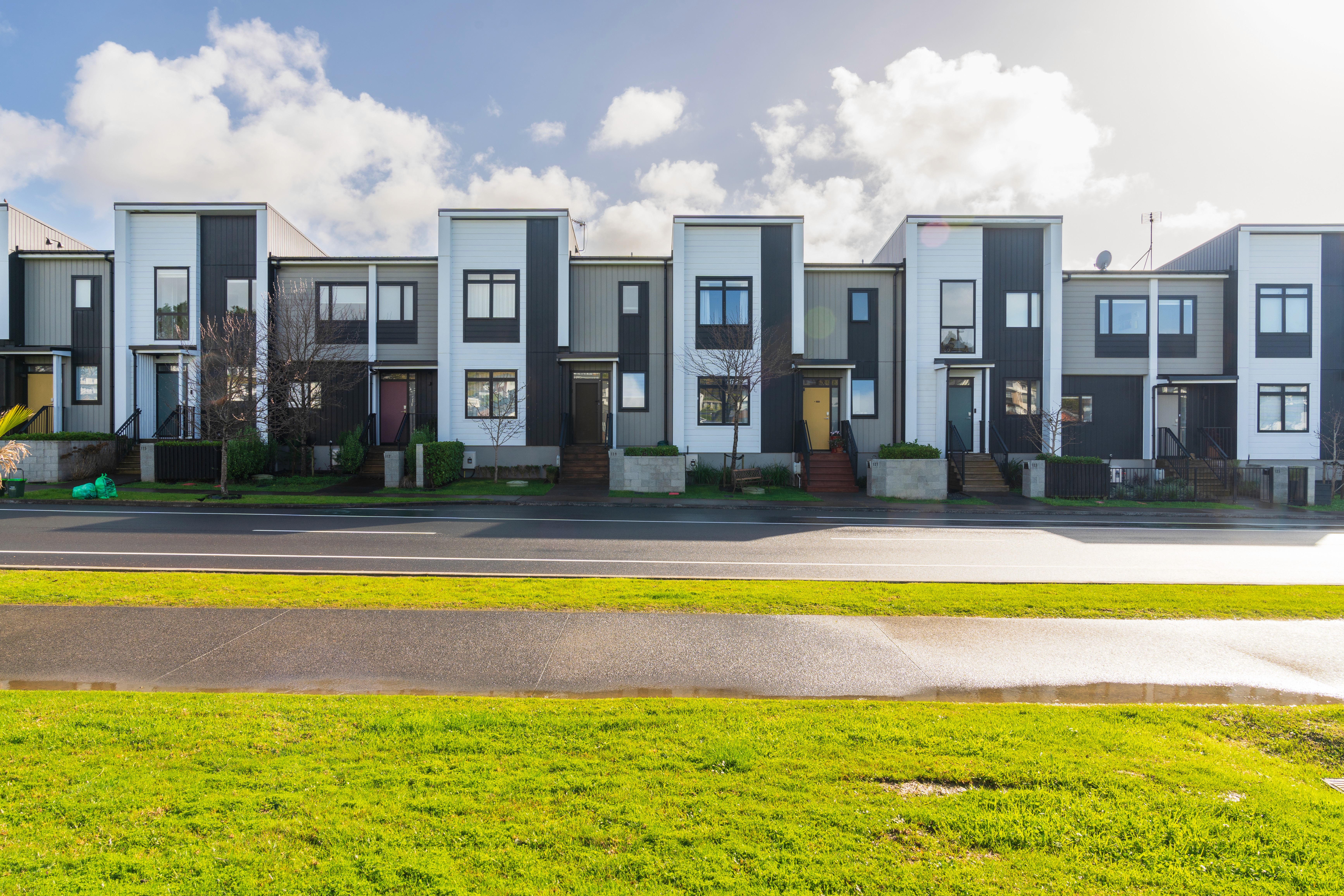 seven construction workers standing on white field