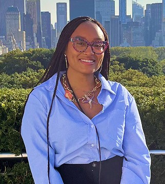 headshot of male in dark background