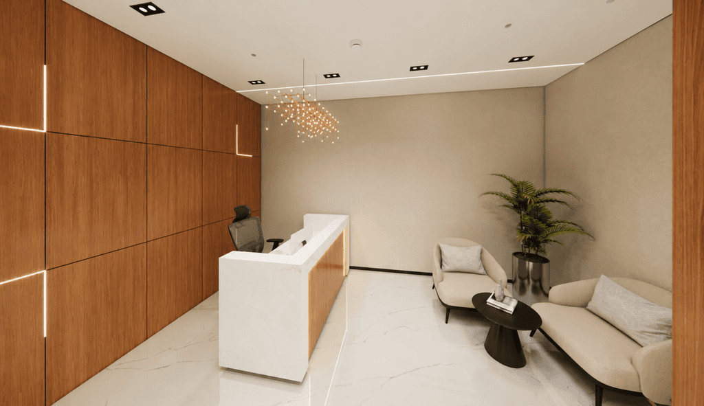 Minimalist reception area in serviced offices in Dubai with cosy seating, wooden feature wall, and muted lighting. 