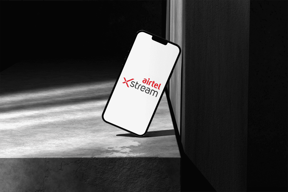 Framer Studio promotional page featuring stacked devices and neon graphics.