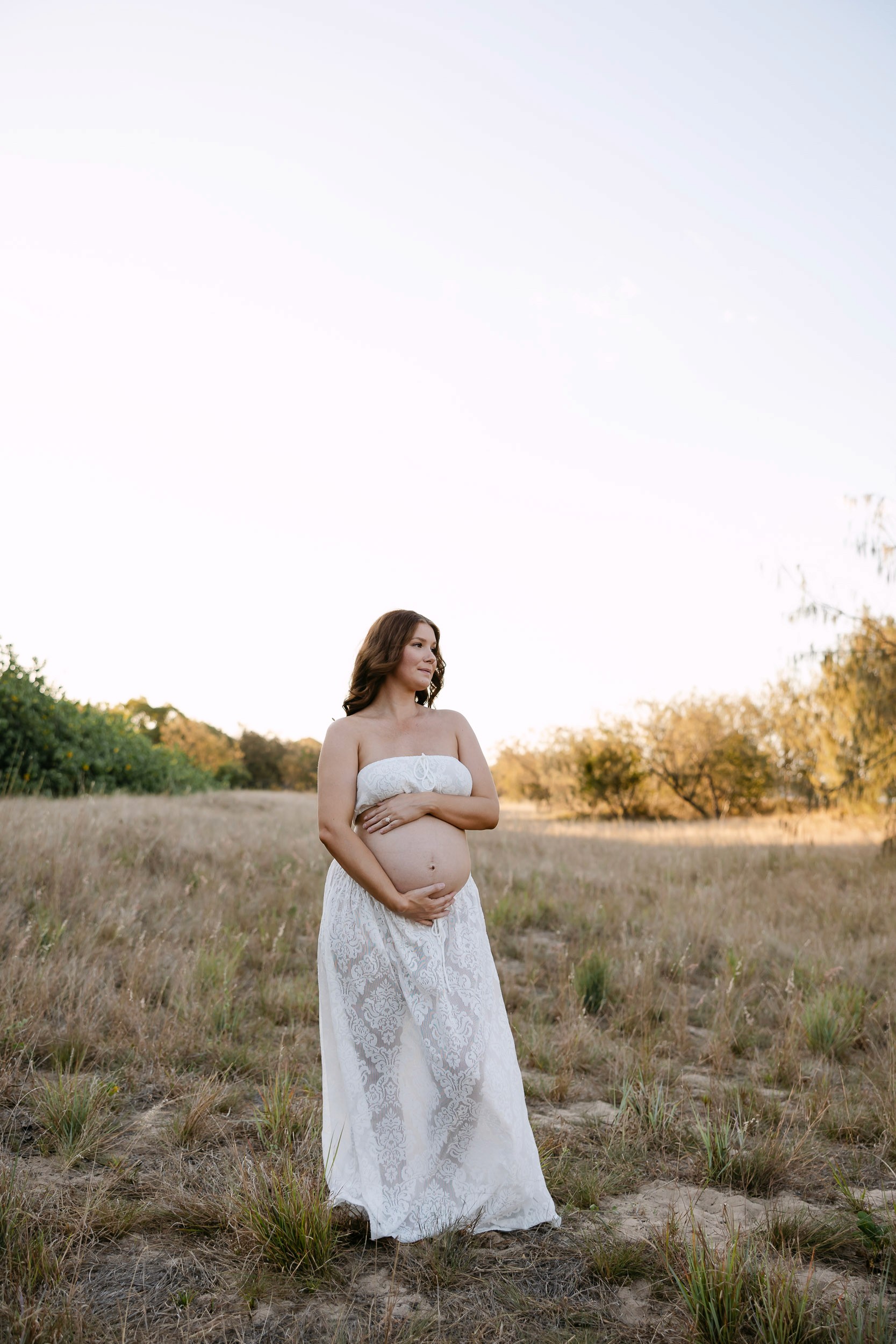 Expecting mother in flowy two piece set for maternity photos near Mackay
