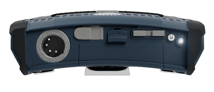 Bottom of the FreeSpeak Cell beltpack showing connectors, flashlight, and battery latch.