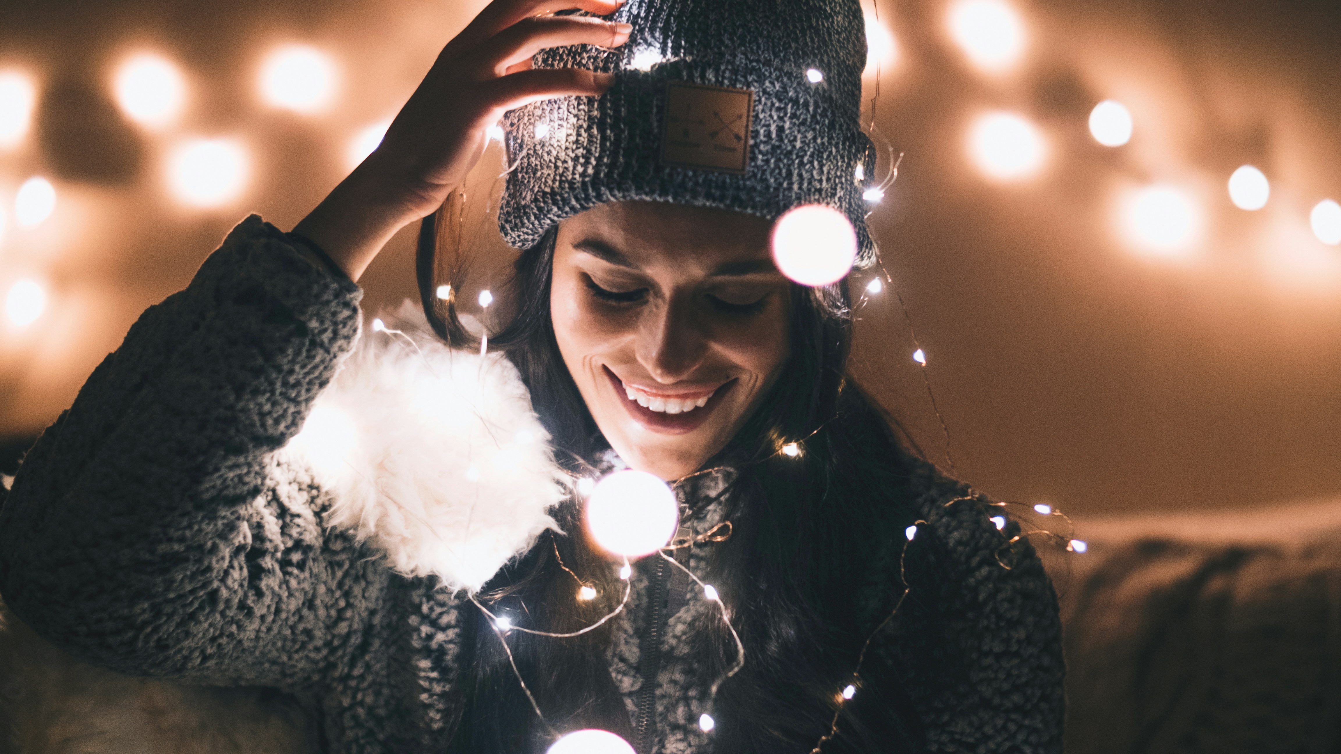 woman looking really happy - How To Layer Skincare