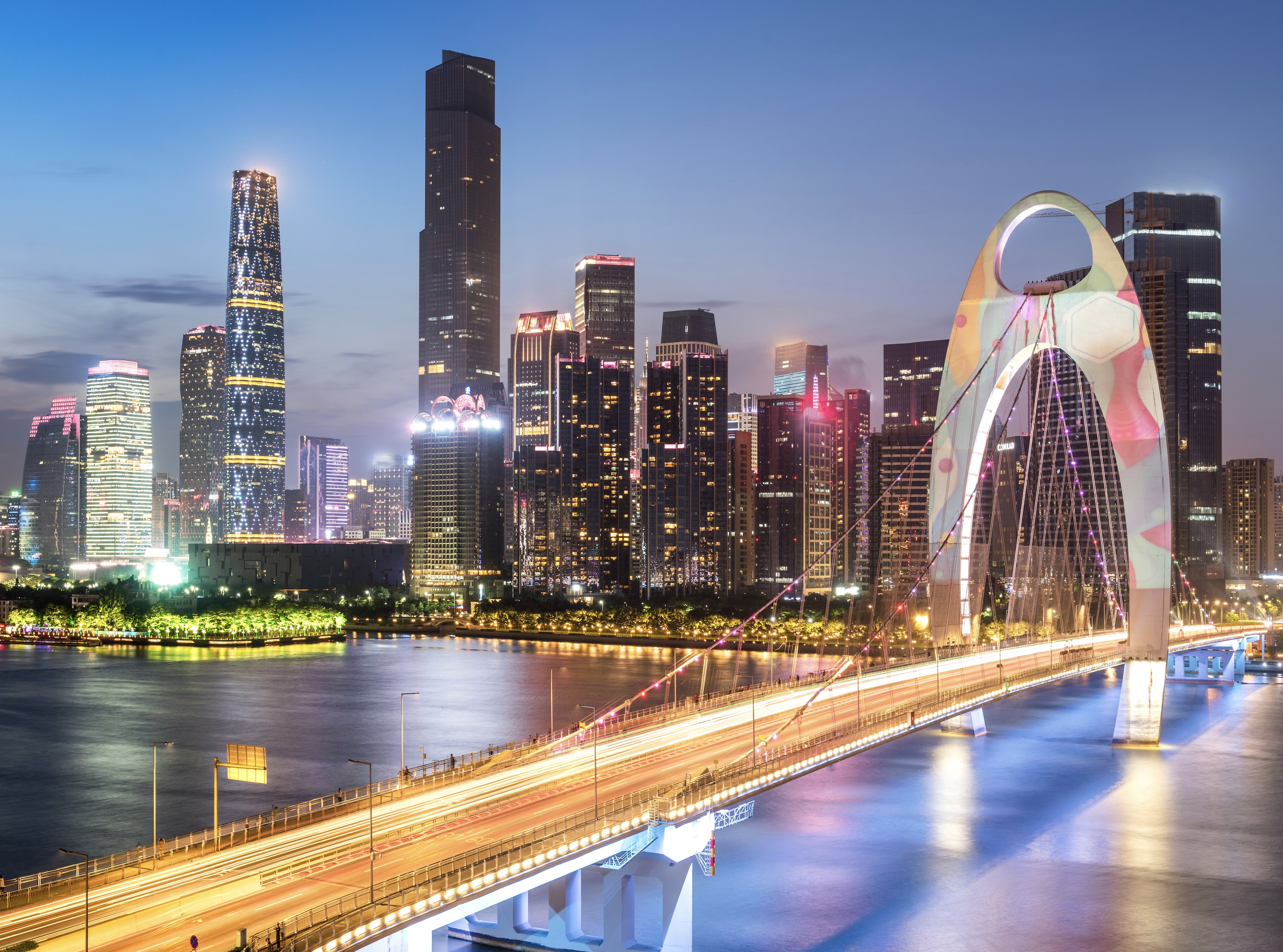 Woman in Shanghai practices fan-work out the front of Aldi supermarket