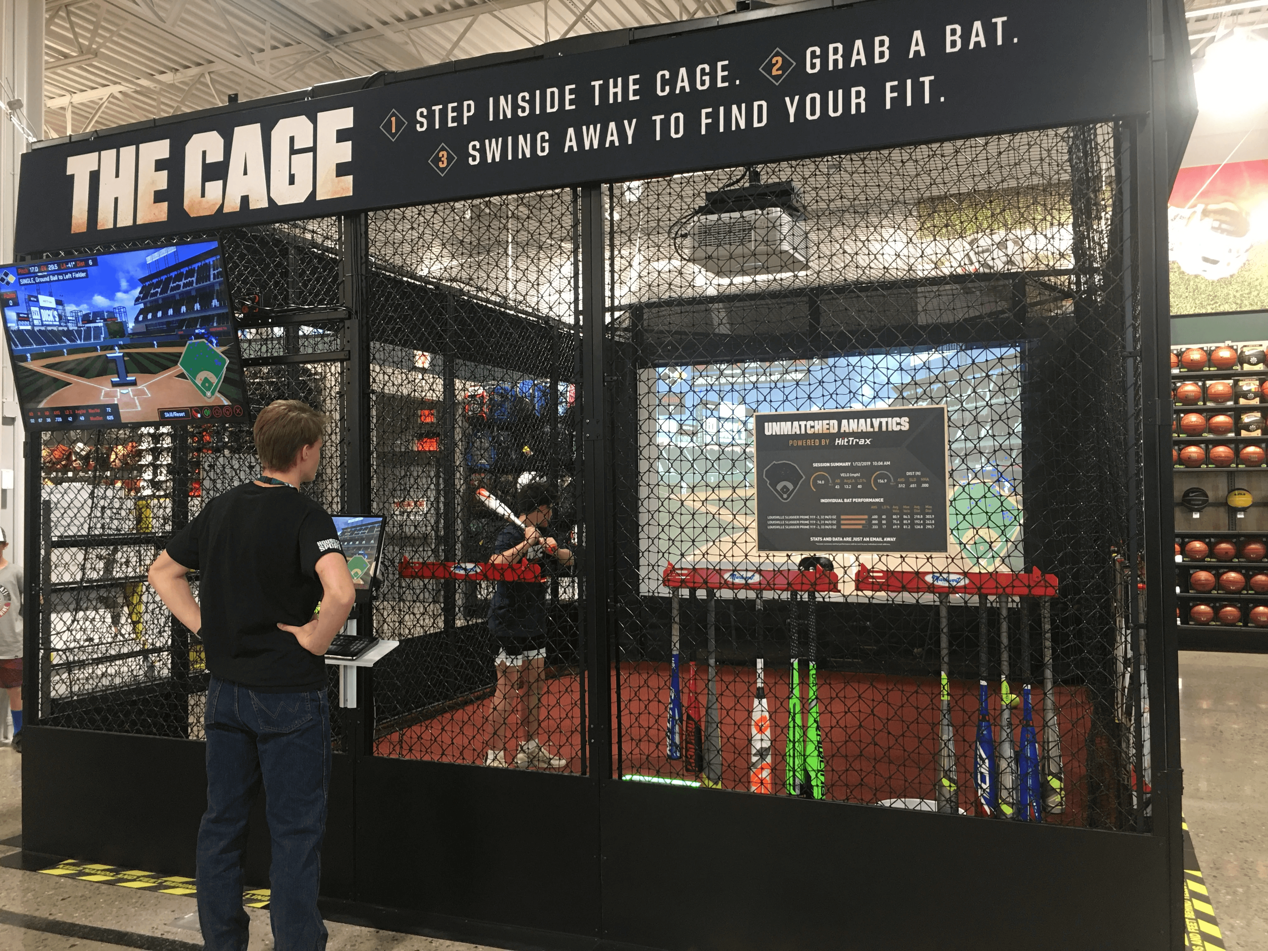 Wide view of the HitTrax Suite installation within the Dick’s Sporting Goods store environment.