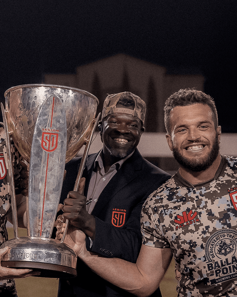 A majestic lion with a full mane stares intensely forward.