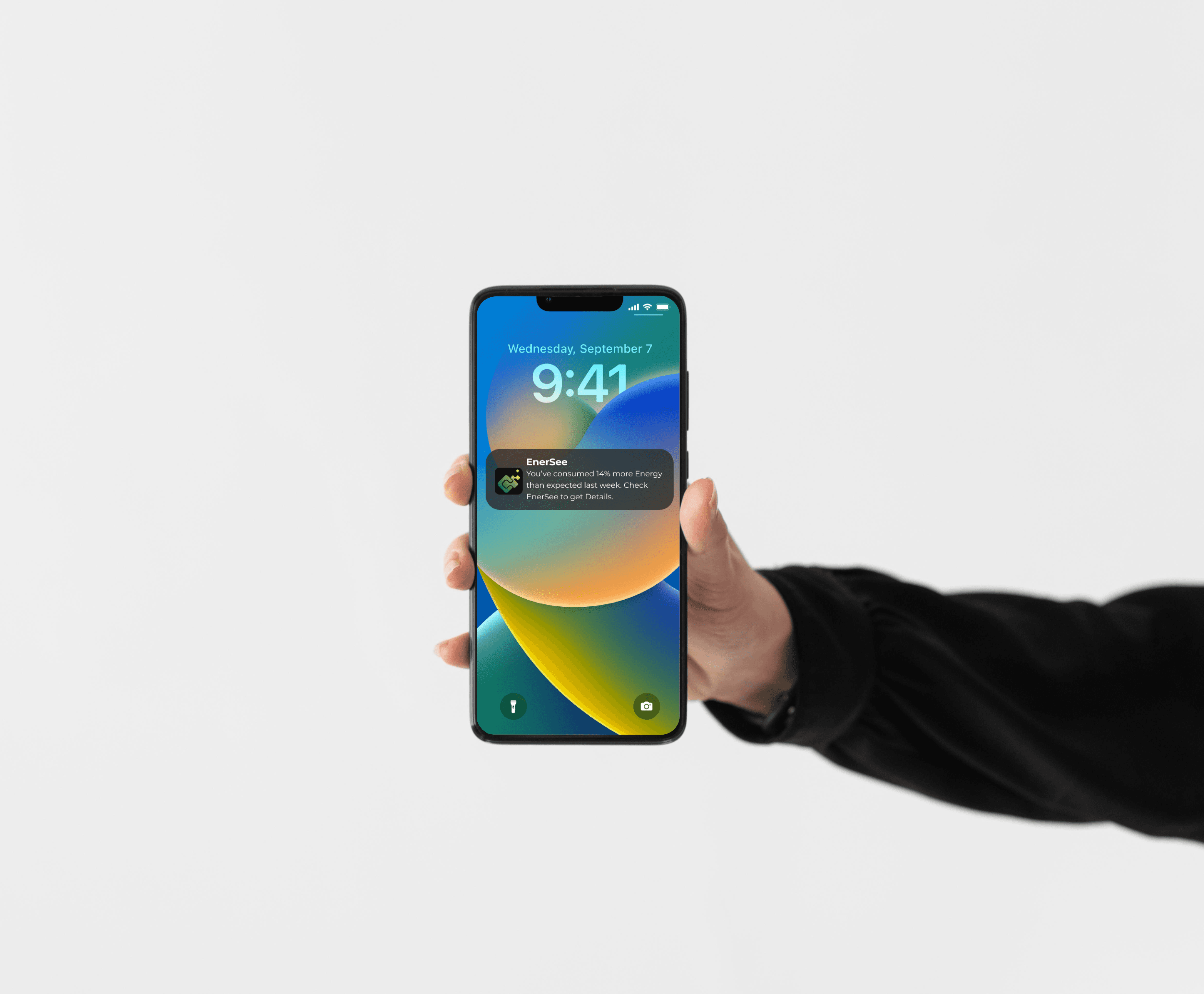 a cellphone leaning against a wall