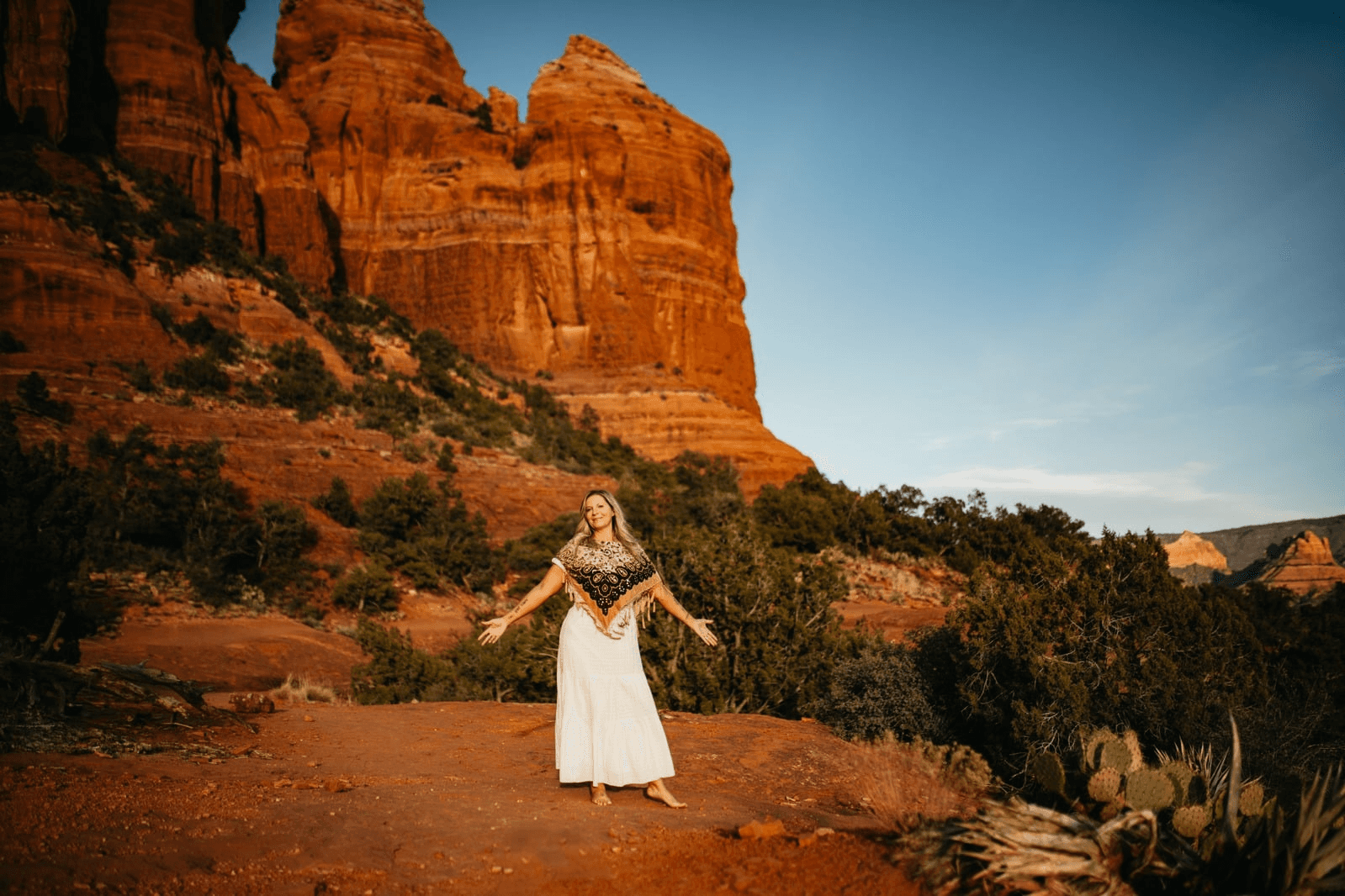 A person resting among desert rocks