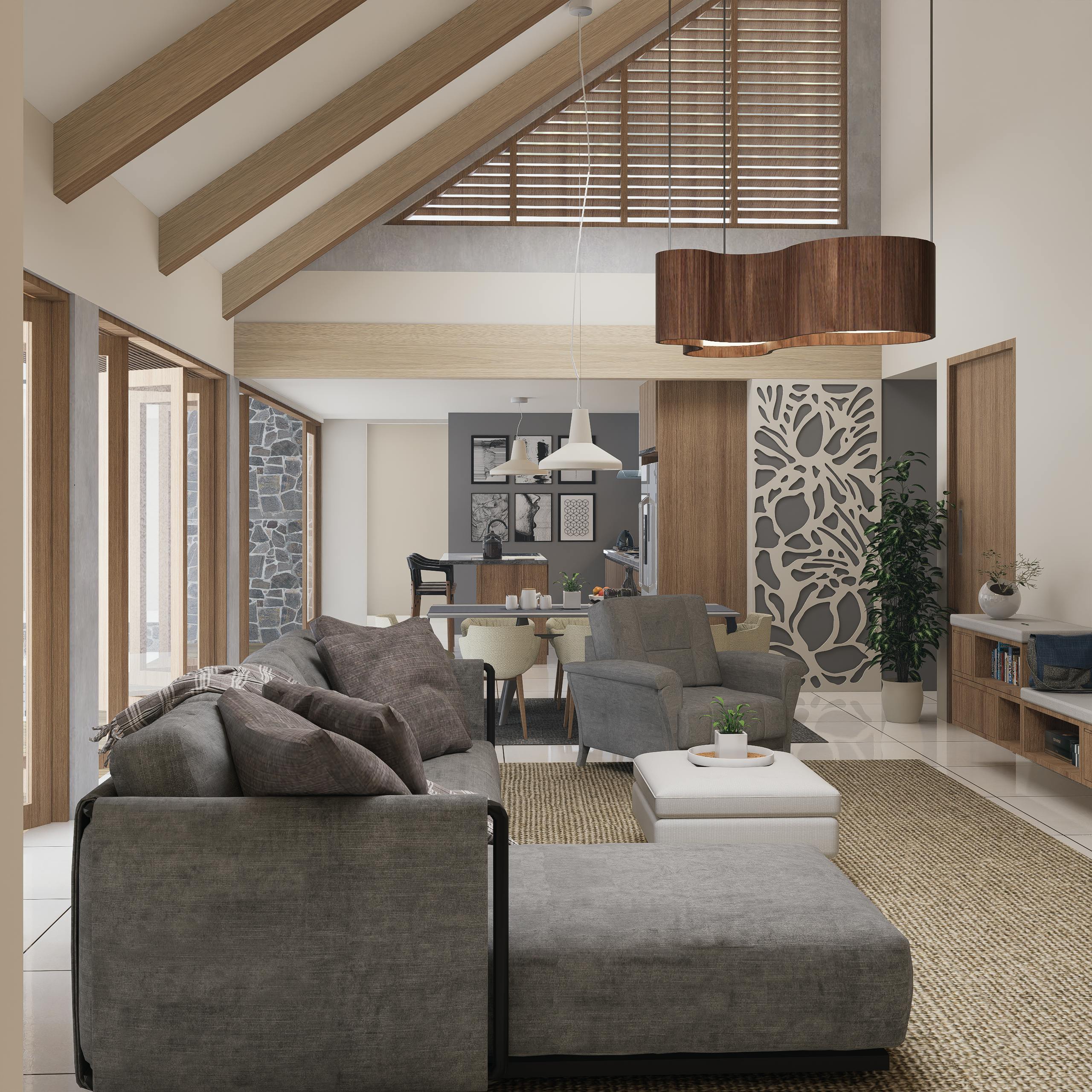 A modern kitchen and living room with white cabinets, herringbone floors, and a gray sectional sofa.